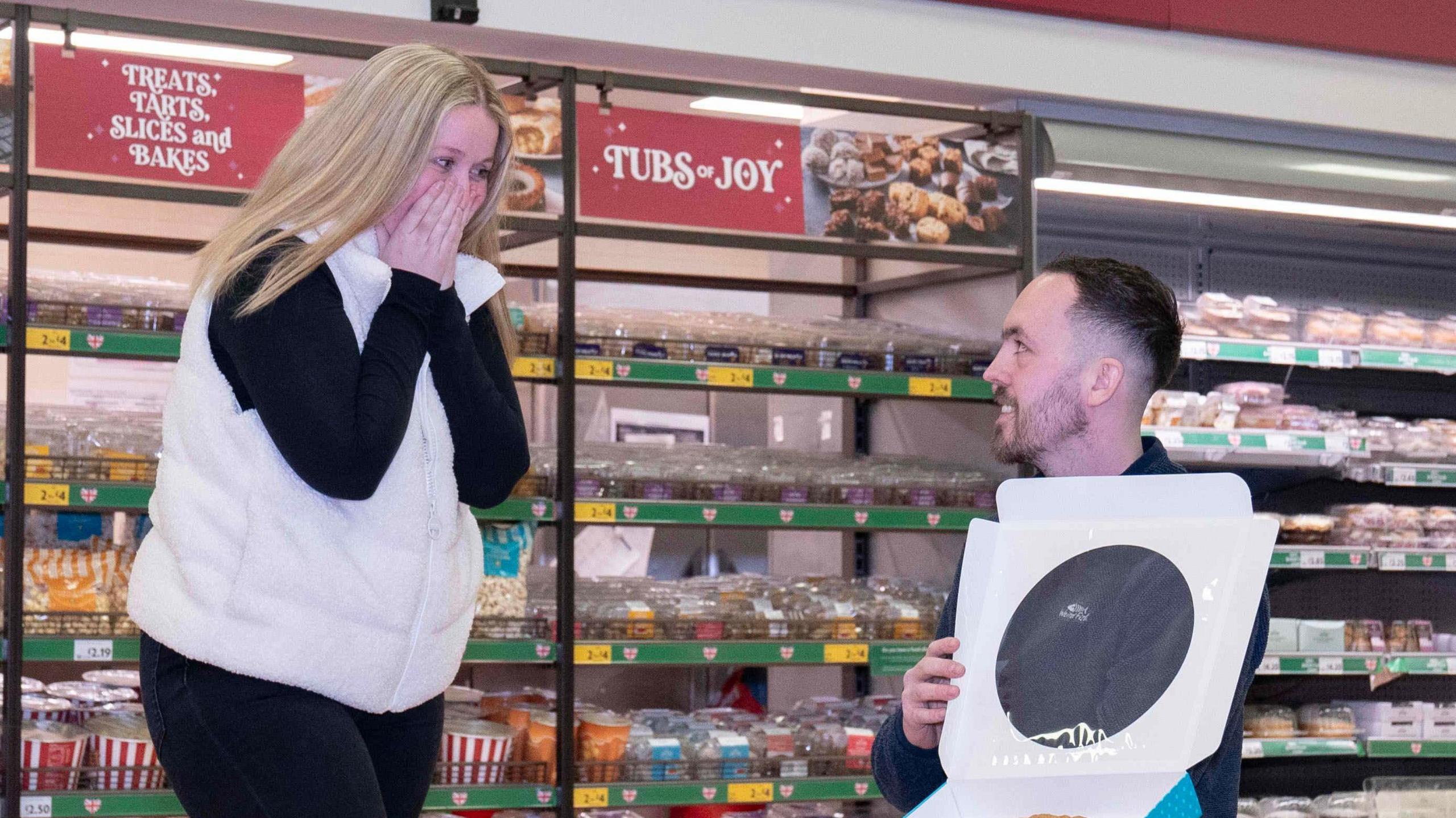 Mr Bullock proposing to Hannah McNaughten at the morrisons bakery counter.