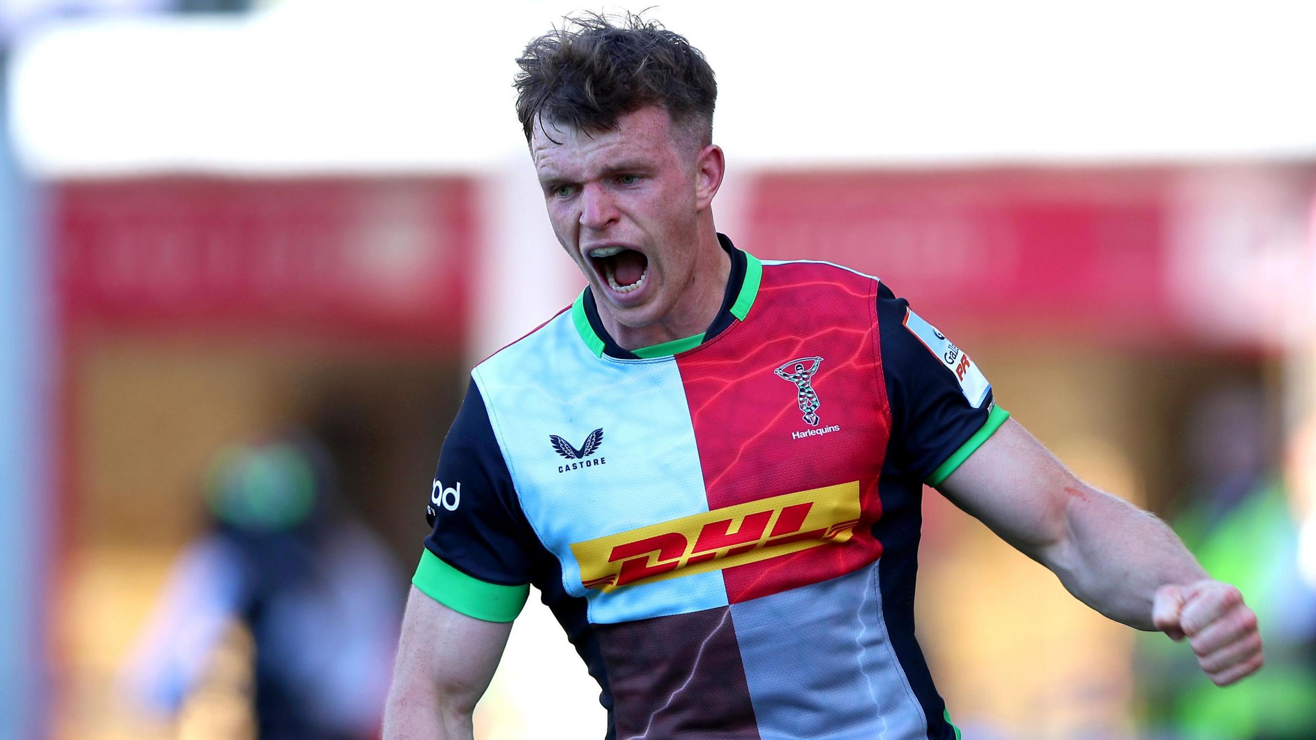 Jamie Benson, wearing the Harlequins home shirt, celebrates a try against Sale in April.
