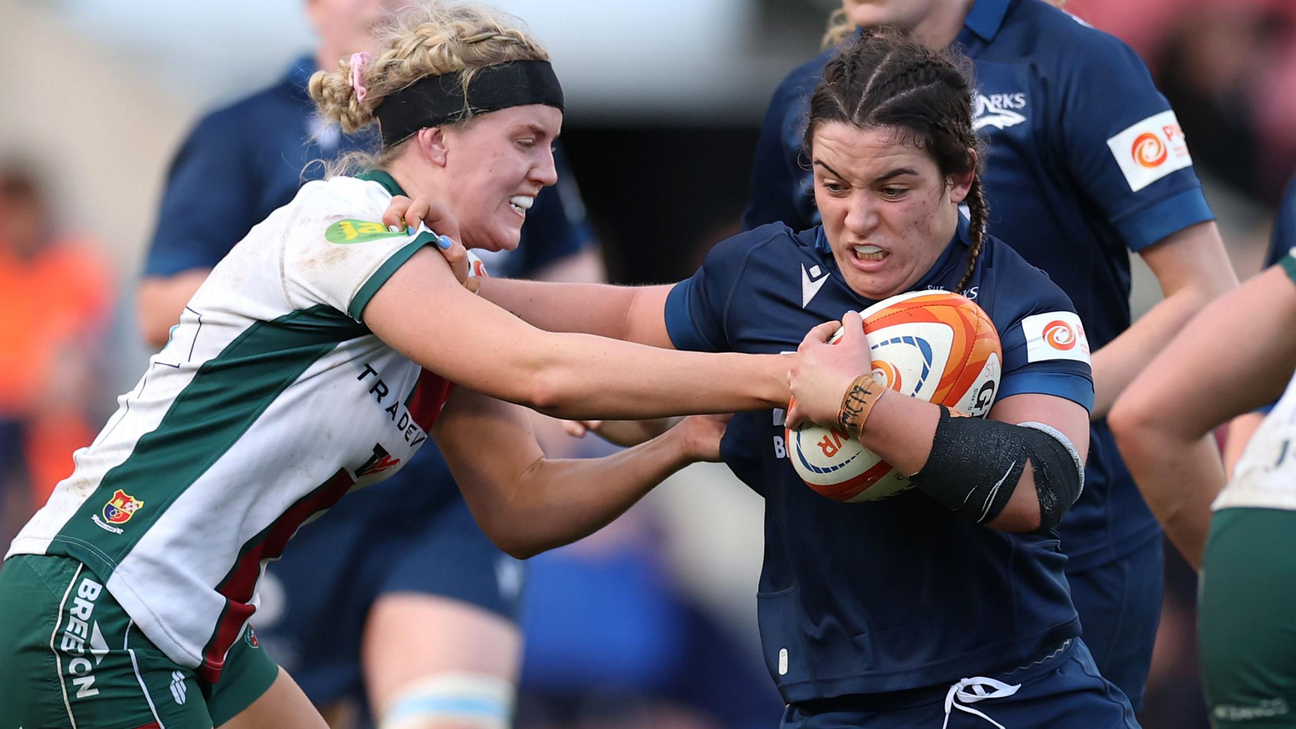 Alba Capell of Sale Sharks hands off Eva Donaldson of Leicester Tigers during the Premiership Women's Rugby match.