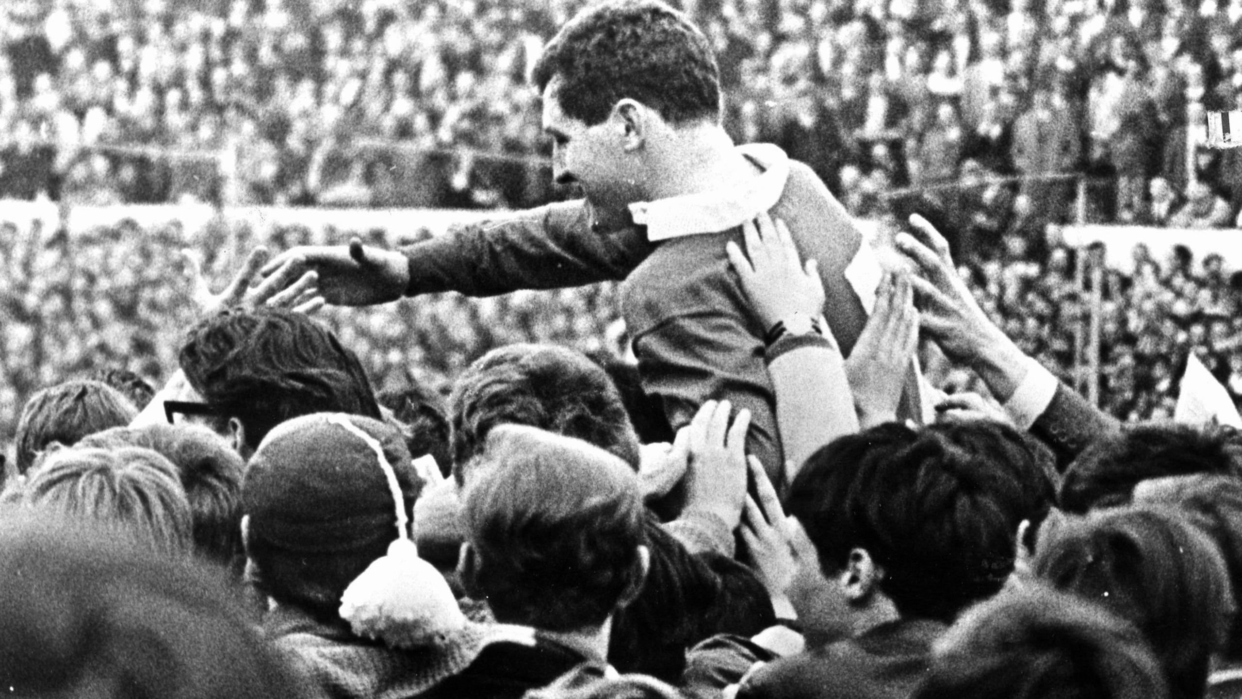 Wales full back Keith Jarrett is carried from the pitch after the then 18-year-old scored 19 points to help crush England on his debut in 1967