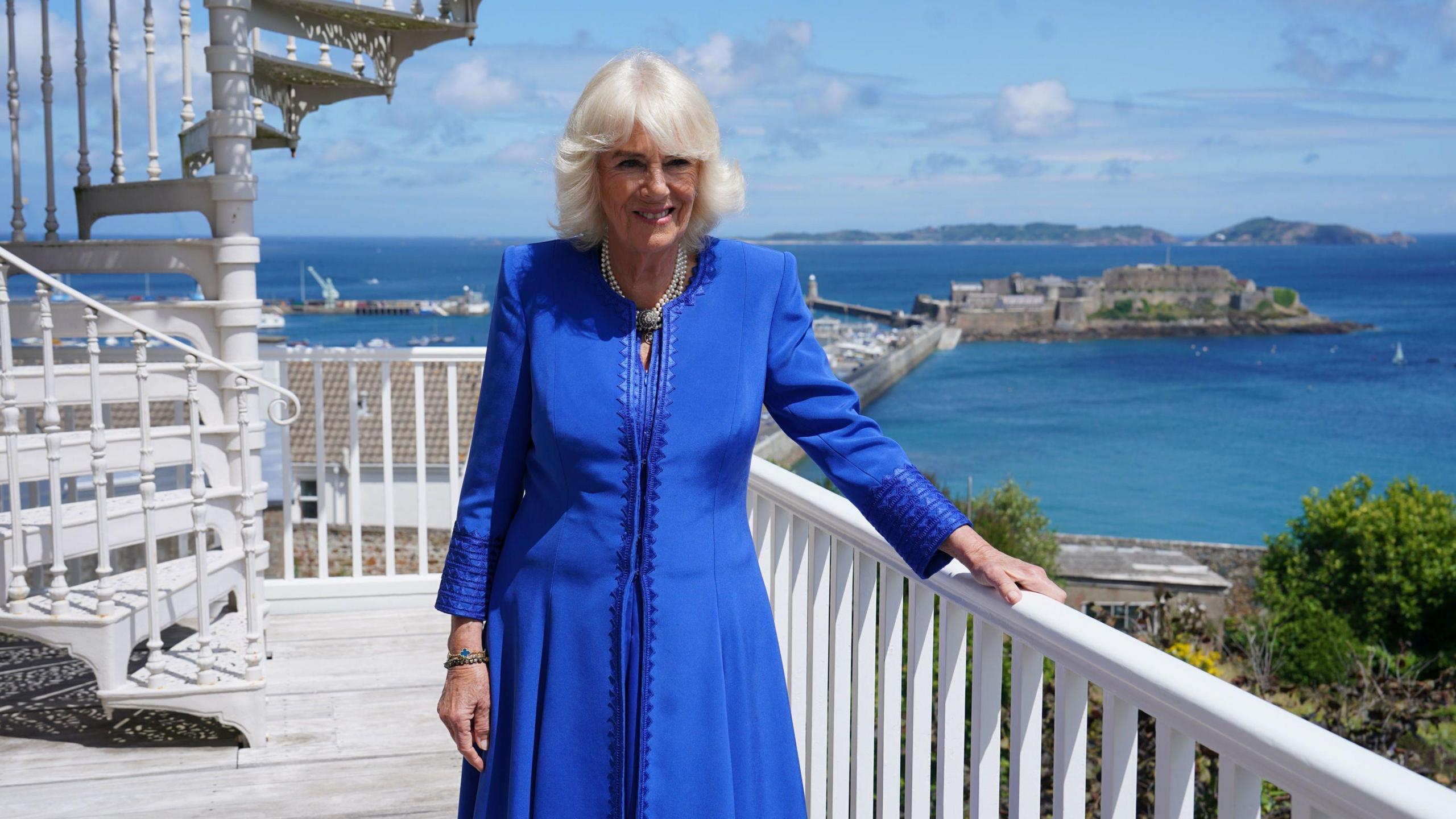 Queen Camilla on a balcony at Hauteville House with a view overlooking the sea