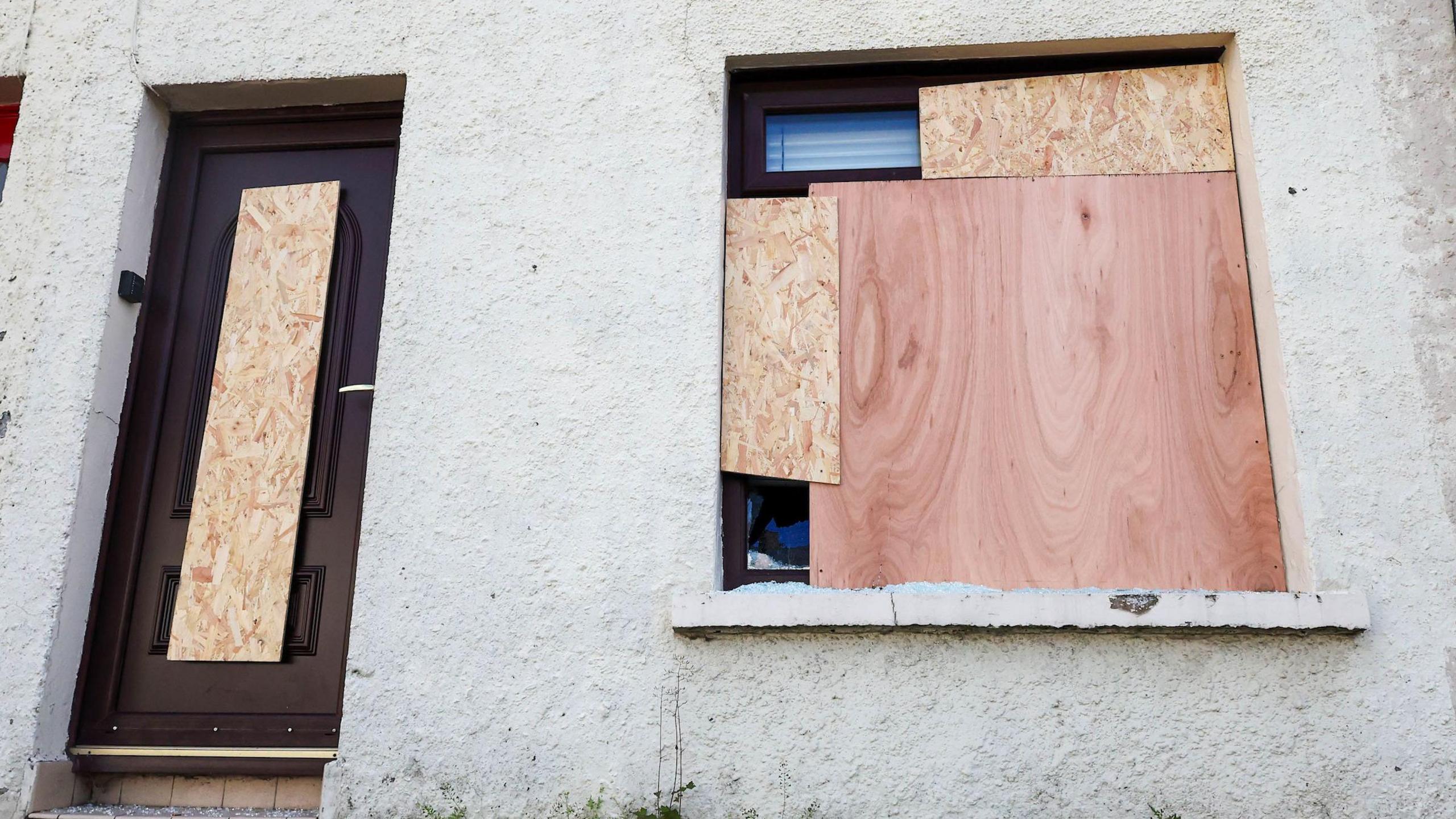 Boarded up window and door of house in Kilburn Street, Belfast