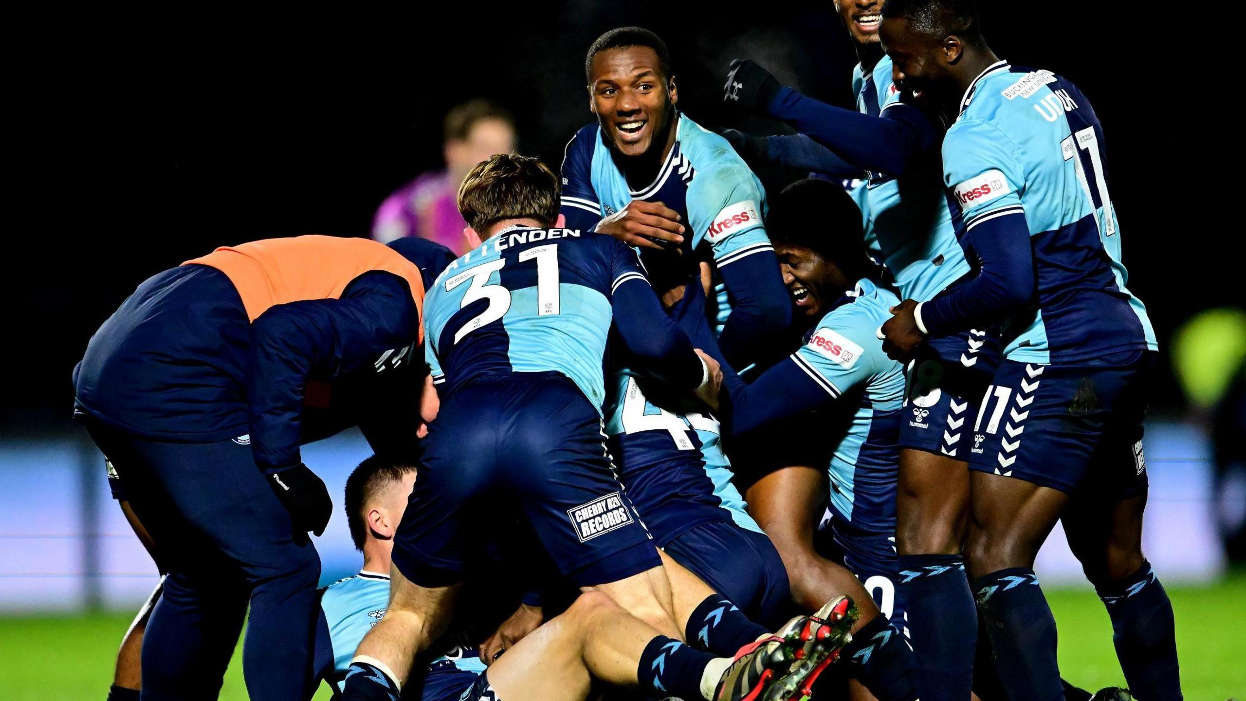 Wycombe Wanderers celebrate a late 1-0 victory over Mansfield in League One