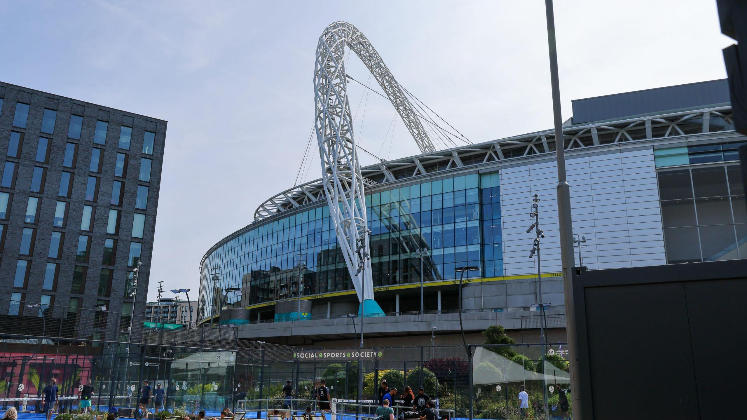 A photo of the outside of Wembley Stadium in the daytime