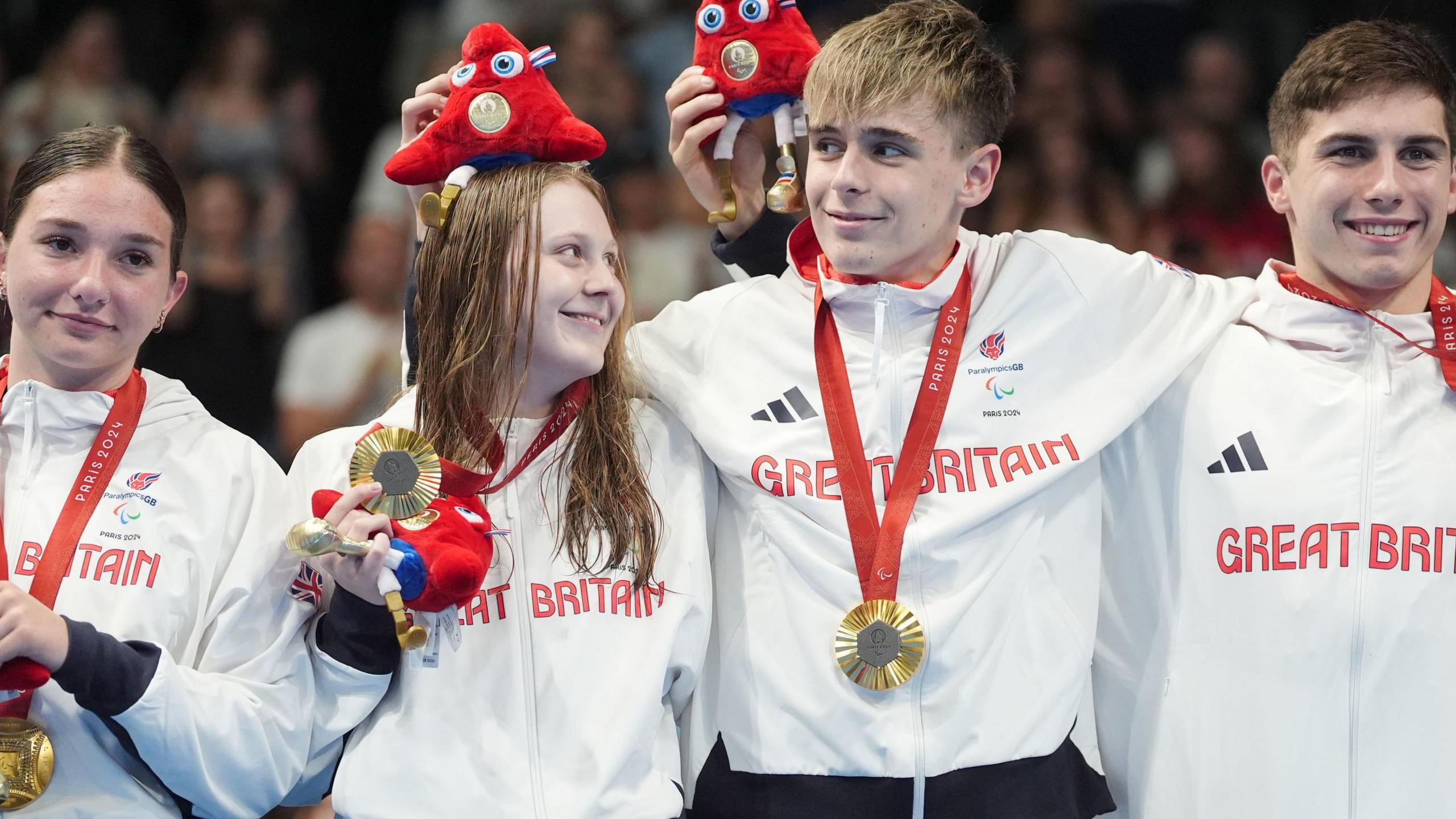 Great Britain's S14 mixed 4x100m relay squad with gold medals