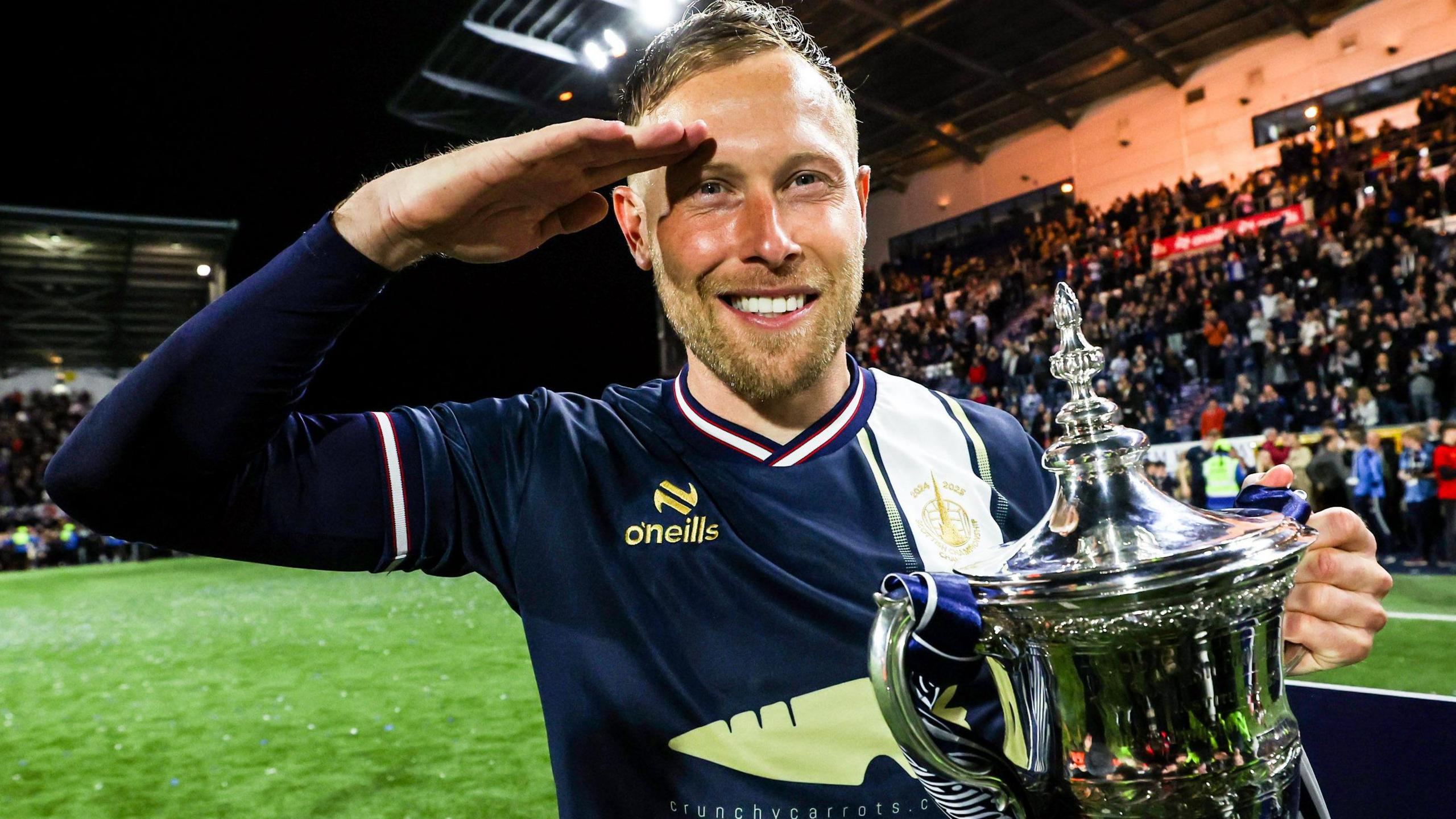 Falkirk’s Scott Arfield celebrates with the William Hill Championship Trophy