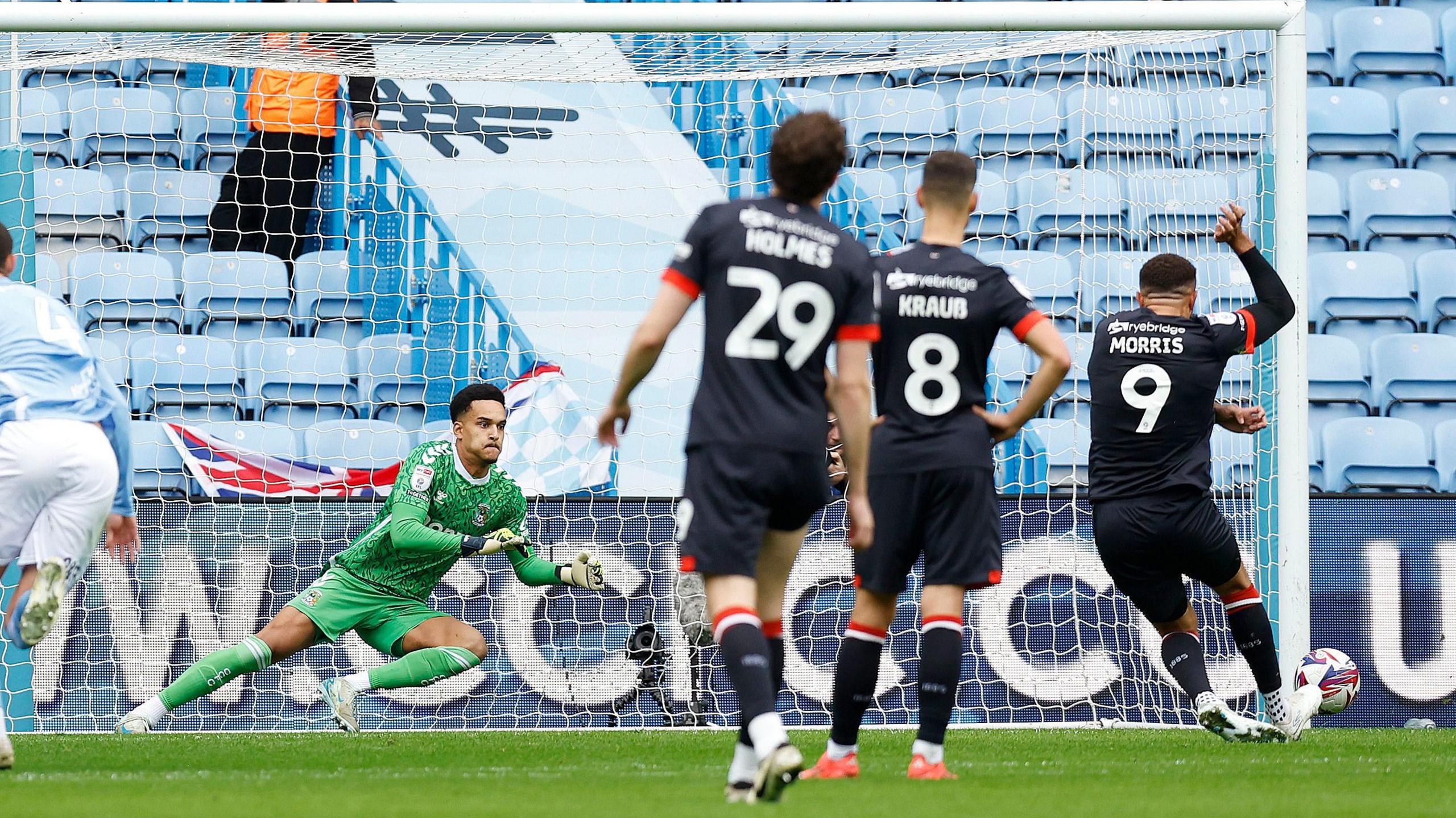 Carlton Morris finds the bottom right corner with his 15th-minute penalty for Luton at Coventry