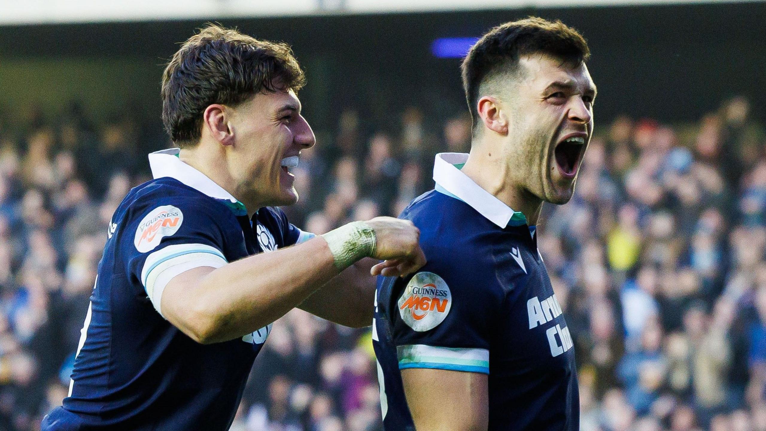 Scotland's Blair Kinghorn (R) celebrates with Tom Jordan after scoring the fifth try during a Guinness Six Nations match between Scotland and Wales at Scottish Gas Murrayfield,