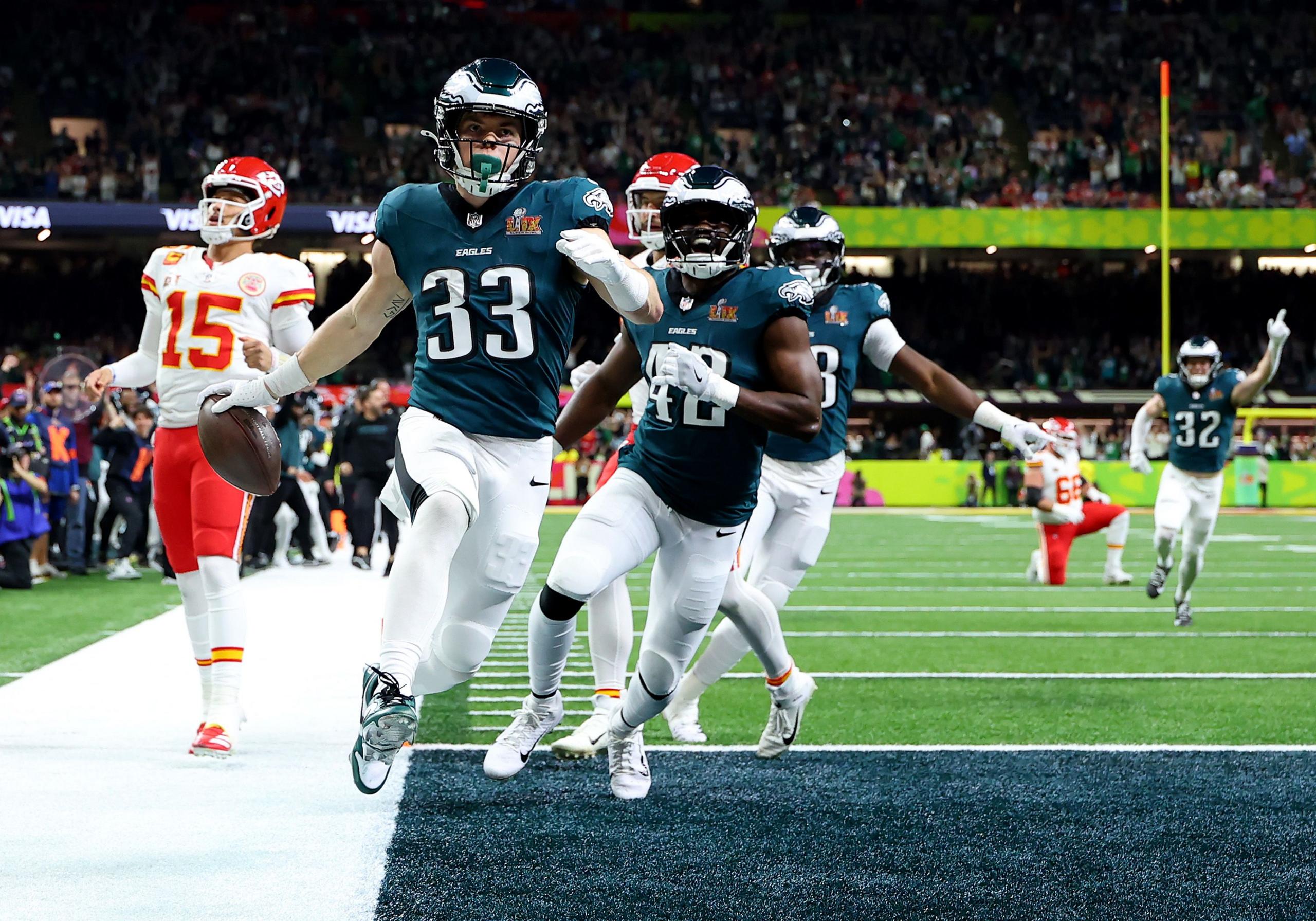 Cooper DeJean of the Philadelphia Eagles celebrates scoring a touchdown after making an interception in the second quarter against the Kansas City Chiefs