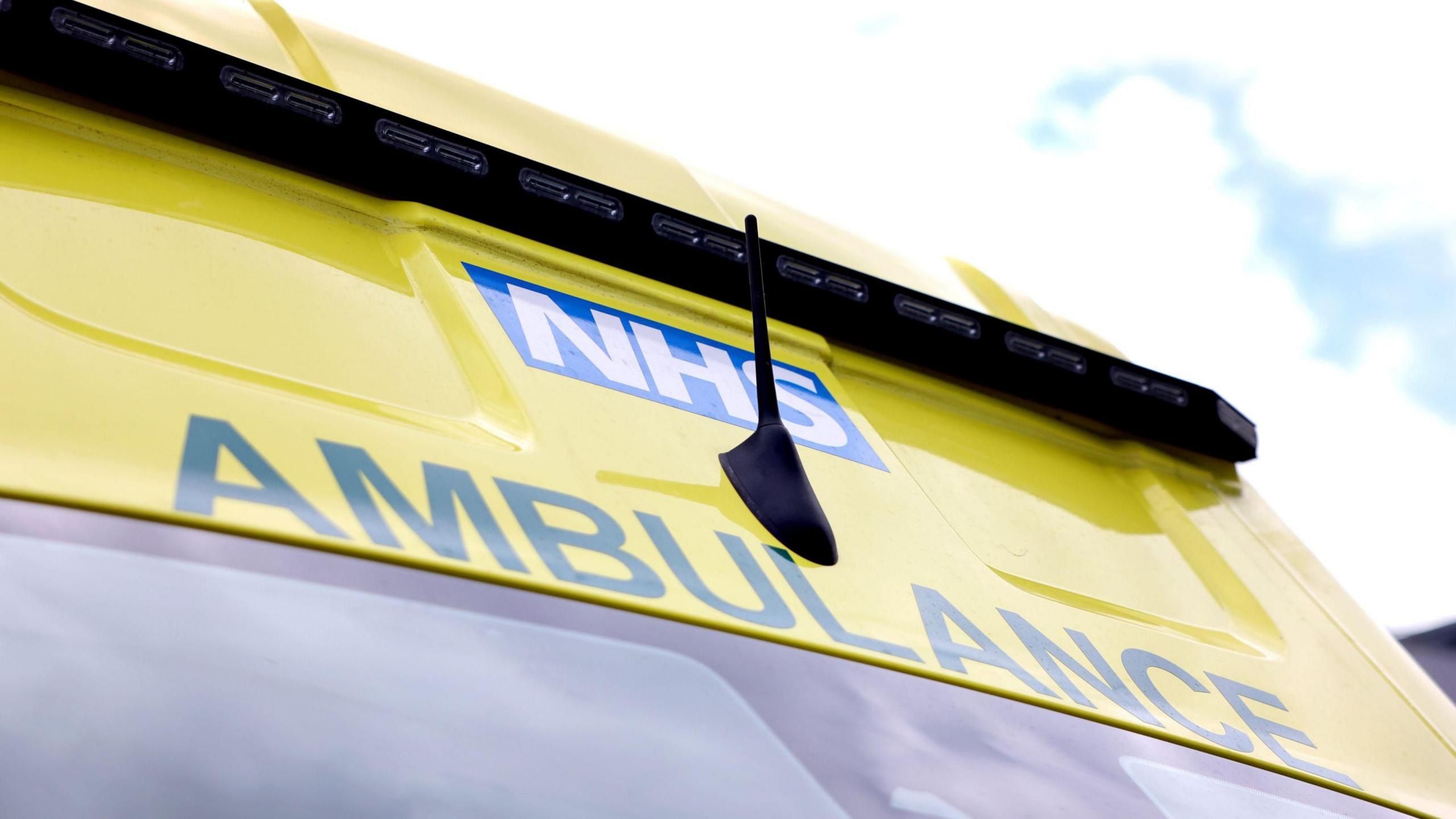 A bright yellow ambulance.