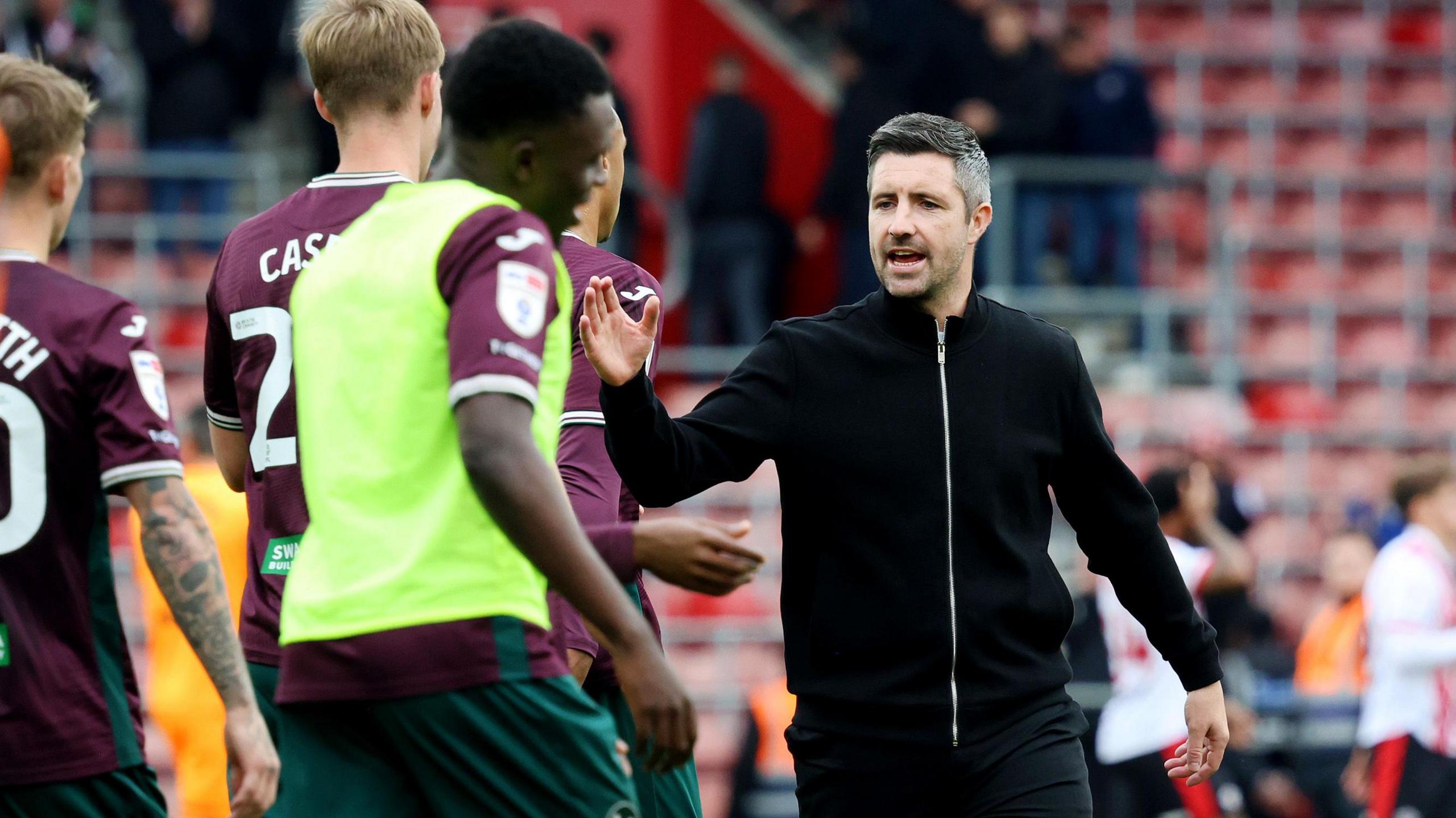 Alan Sheehan with his players after Swansea's draw at Southampton