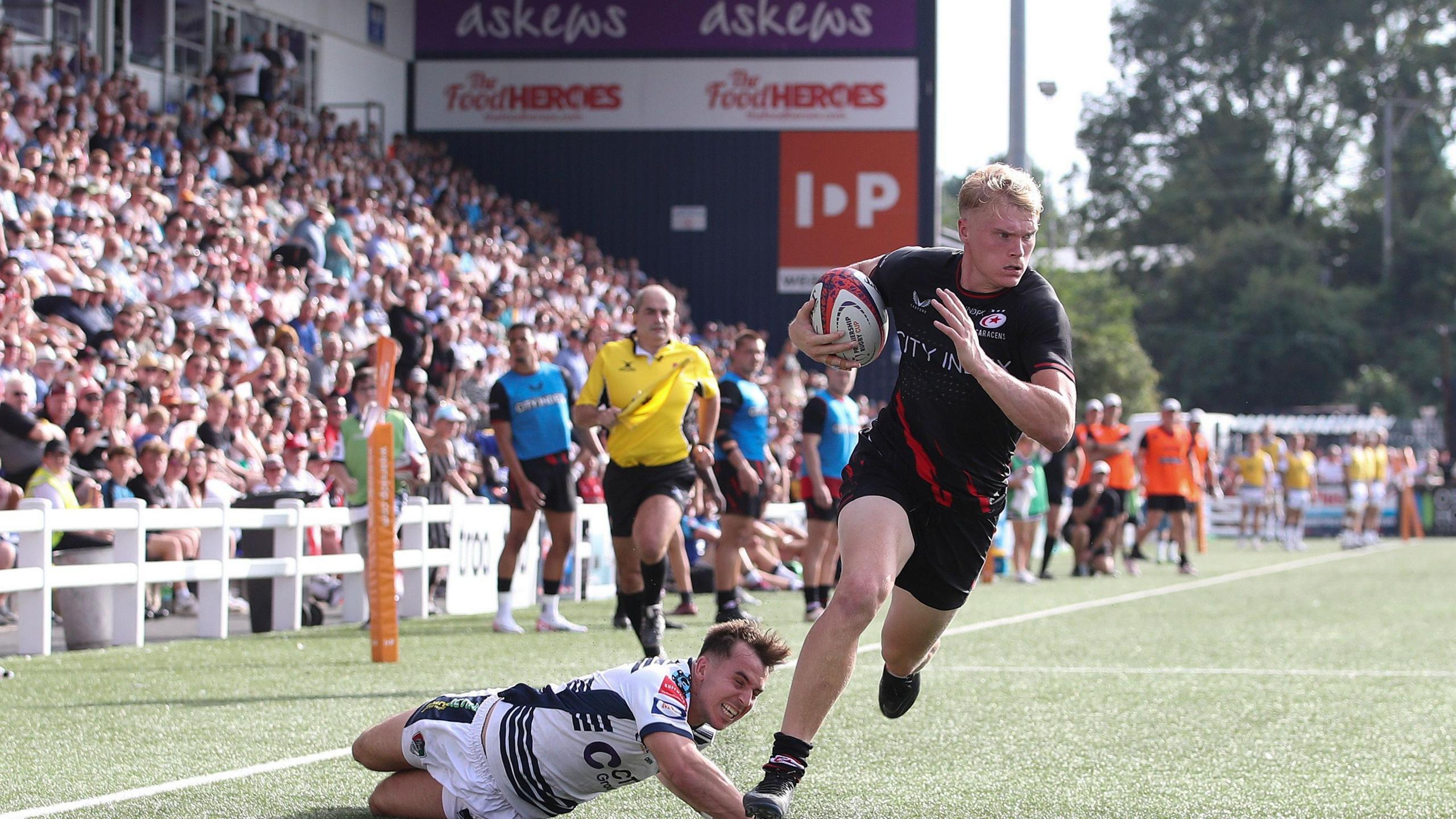 Ben Harris scores a try for then-reigning champions Saracens at Coventry's Butts Park Arena in September 2023