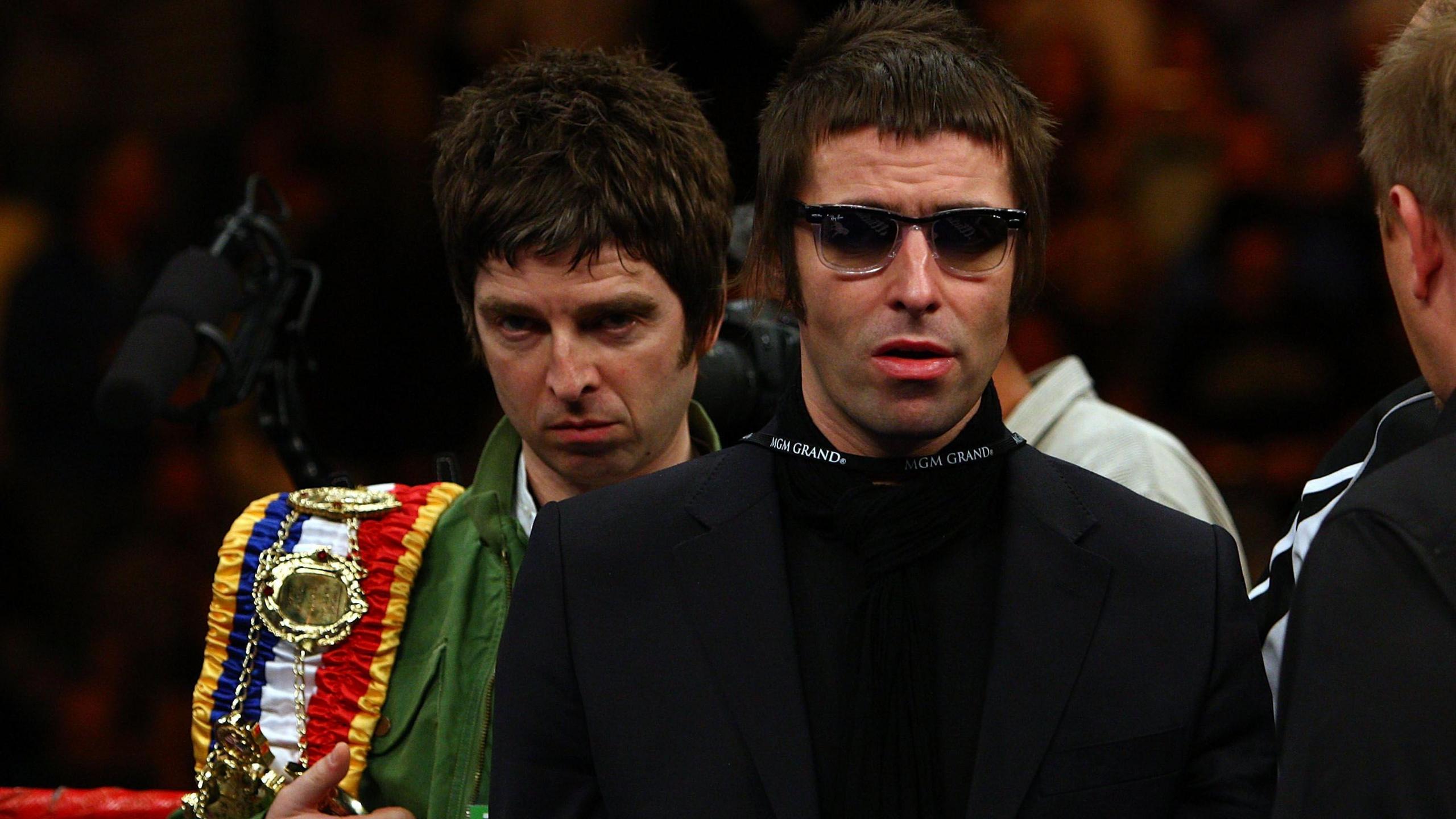Noel and Liam Gallagher of Oasis bring out boxer Ricky Hatton's belts before his fight against Paulie Malignaggi