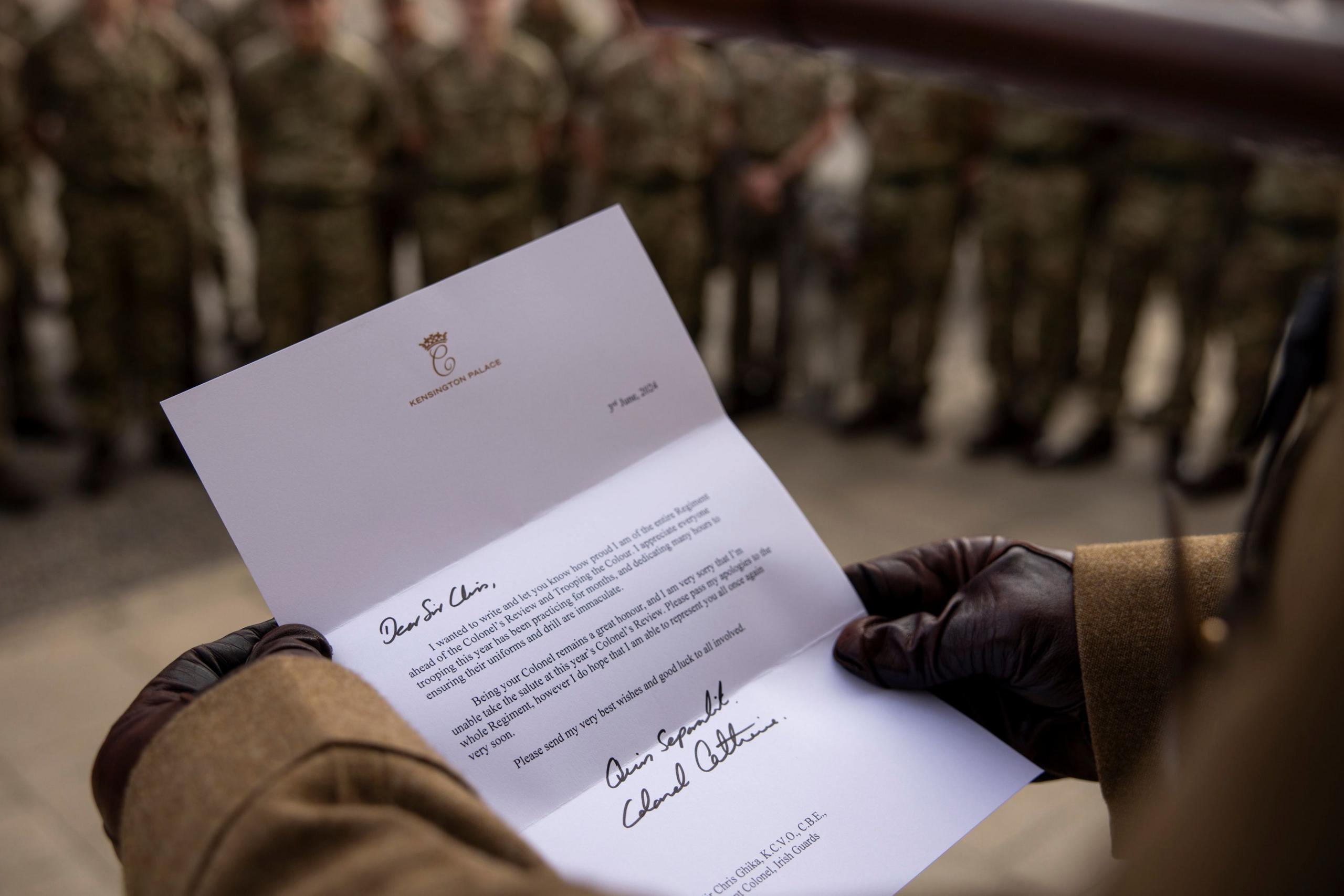 Picture of Princess Catherine's letter being read to members of Irish Guards regiment