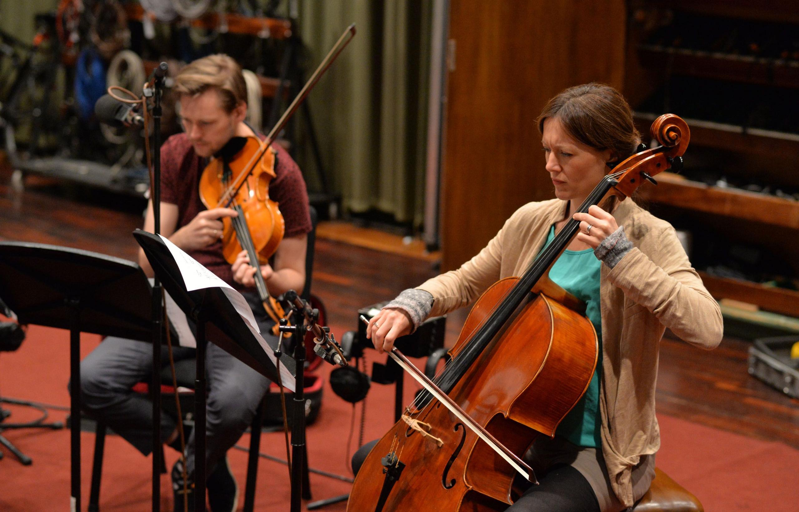Session musicians play the violin and cello at BBC's Maida Vale Studios