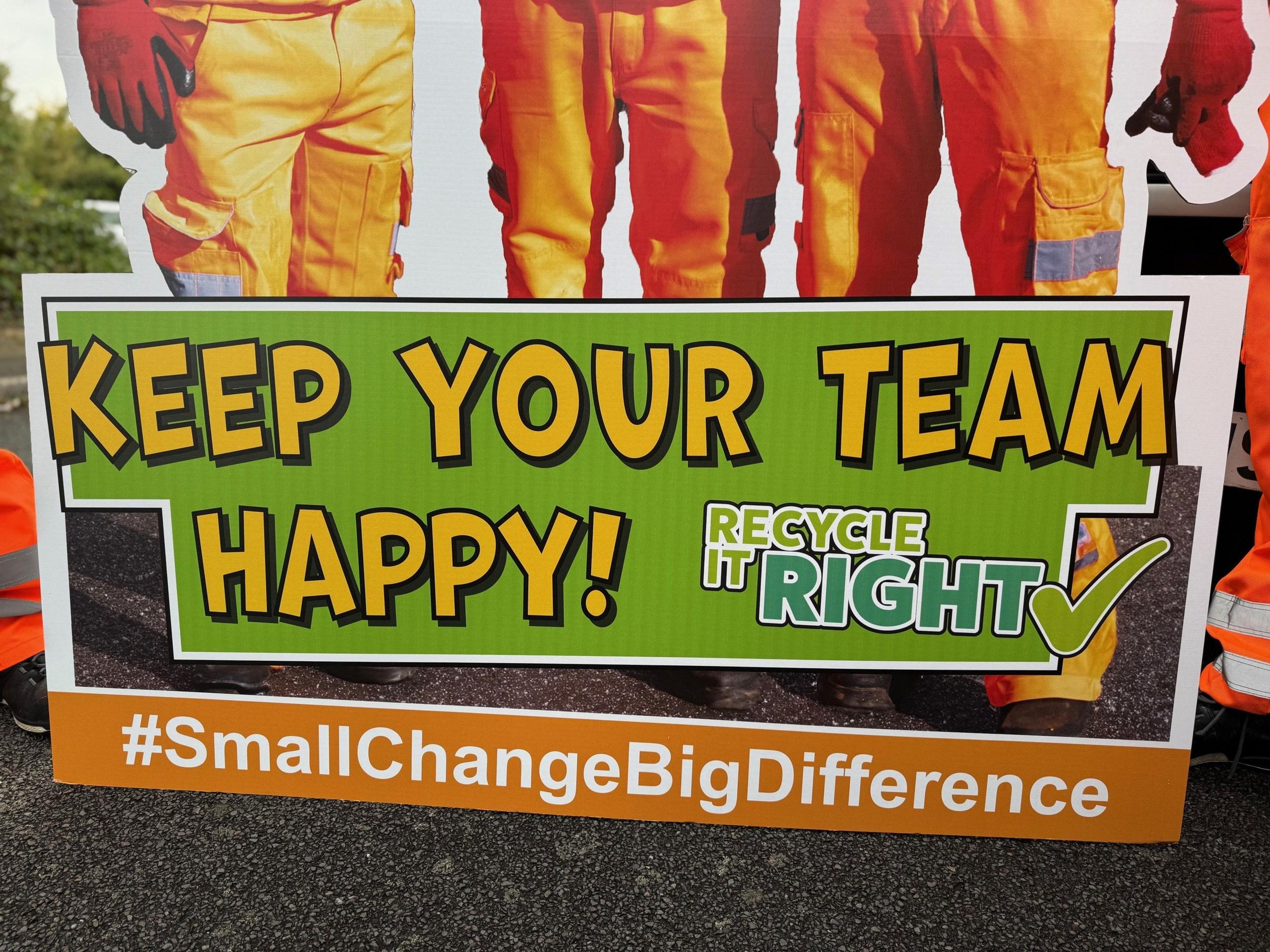 A cardboard cut out has the words #SmallChangeBigDifference which is part of the recycling education campaign