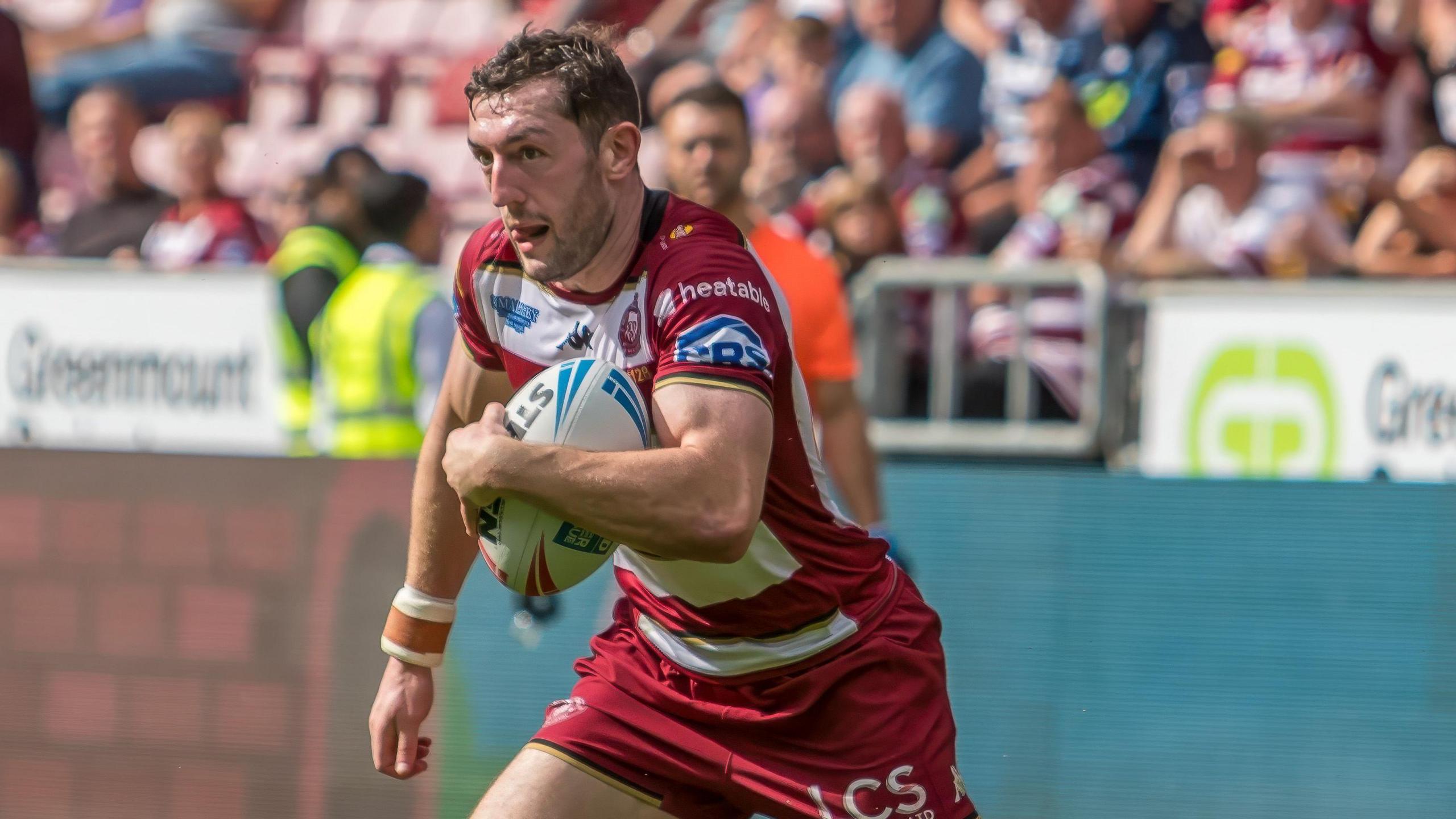 Wigan Warriors' Jake Wardle carrying ball in hand