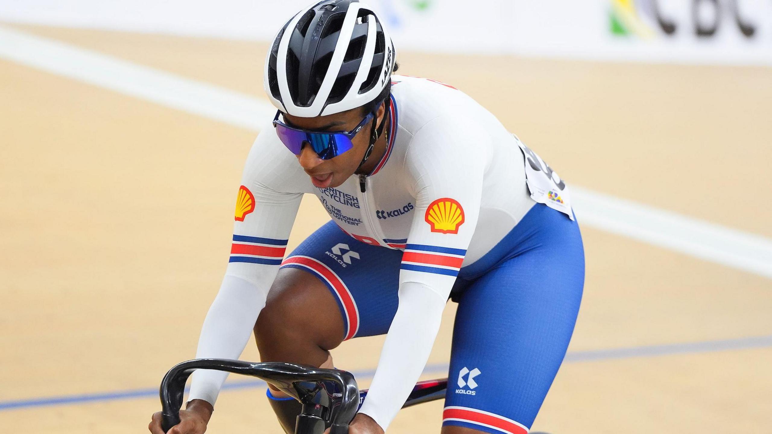 Para-cyclist Kadeena Cox riding her bike while wearing Great Britain colours