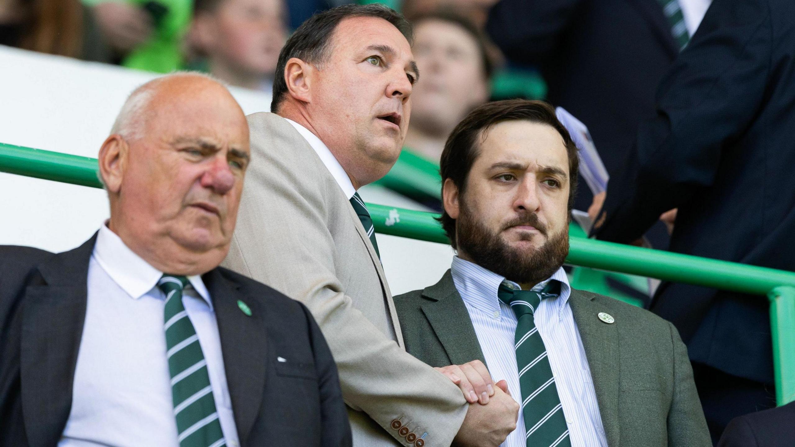 Hibs director of football Malky Mackay (centre) and owner Ian Gordon (right)