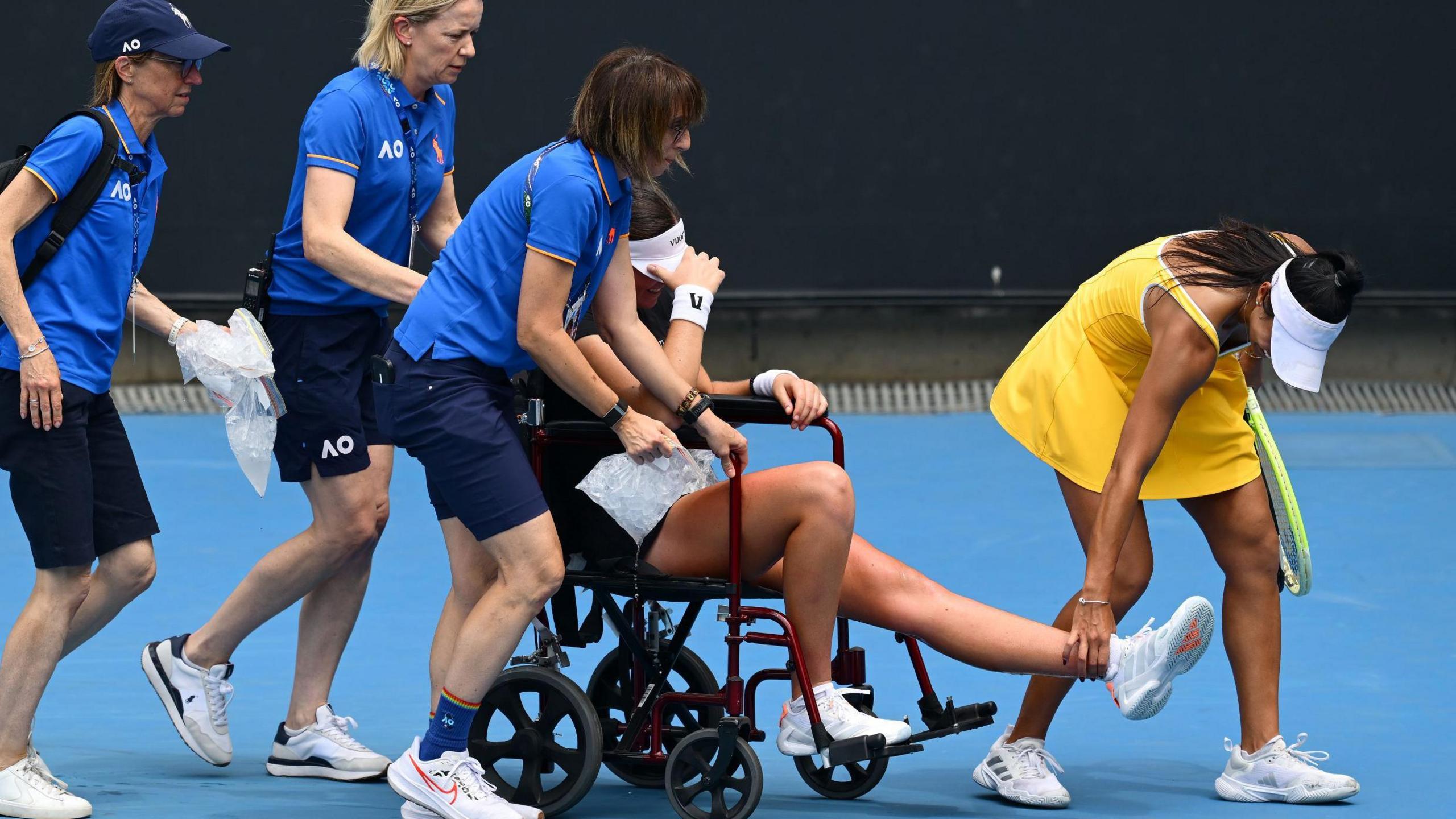 Marina Stakusic is wheeled off court at the Australian Open