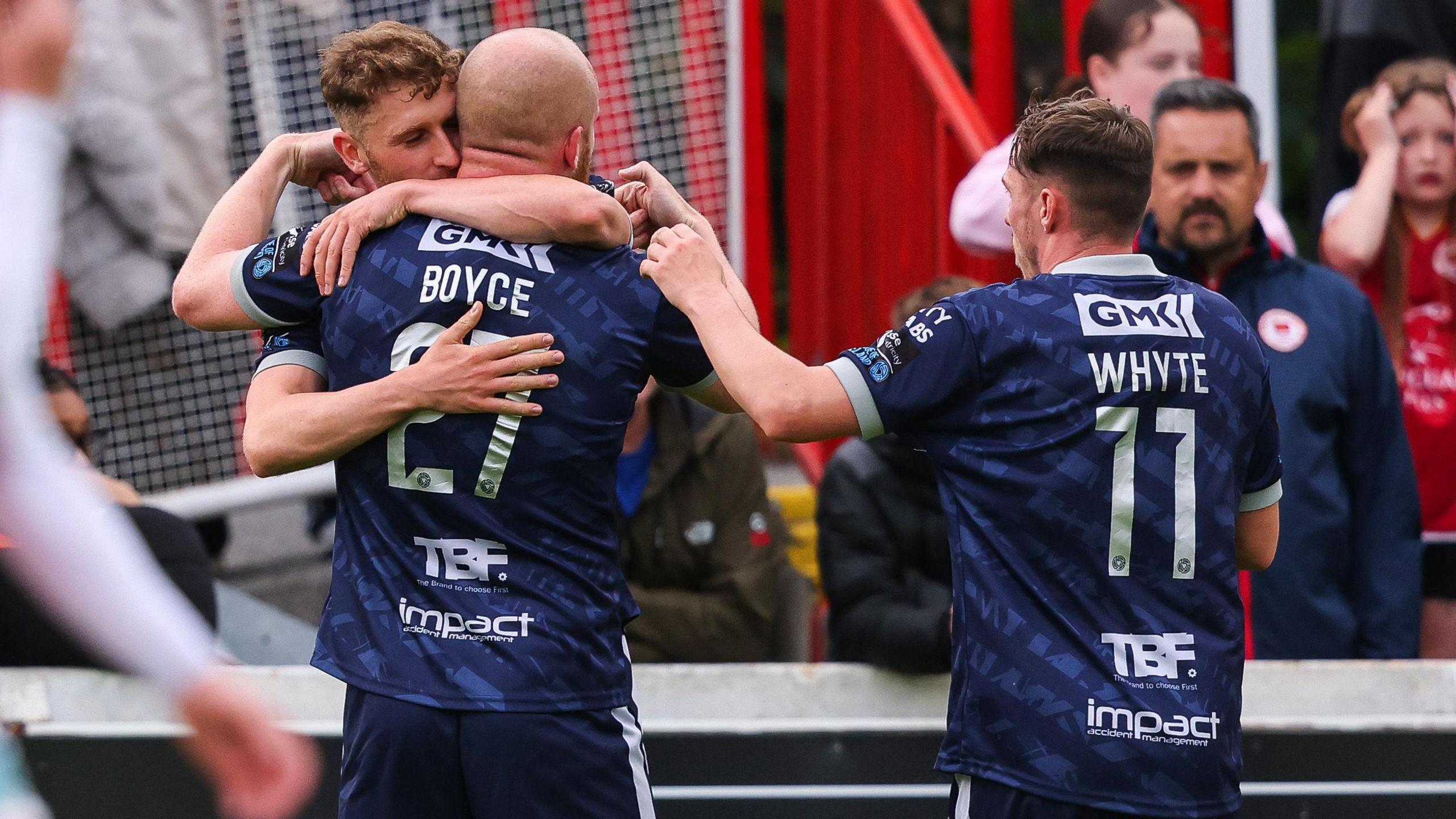 Liam Boyce, Gavin Whyte and Ronan Boyce celebrating the Derry goal