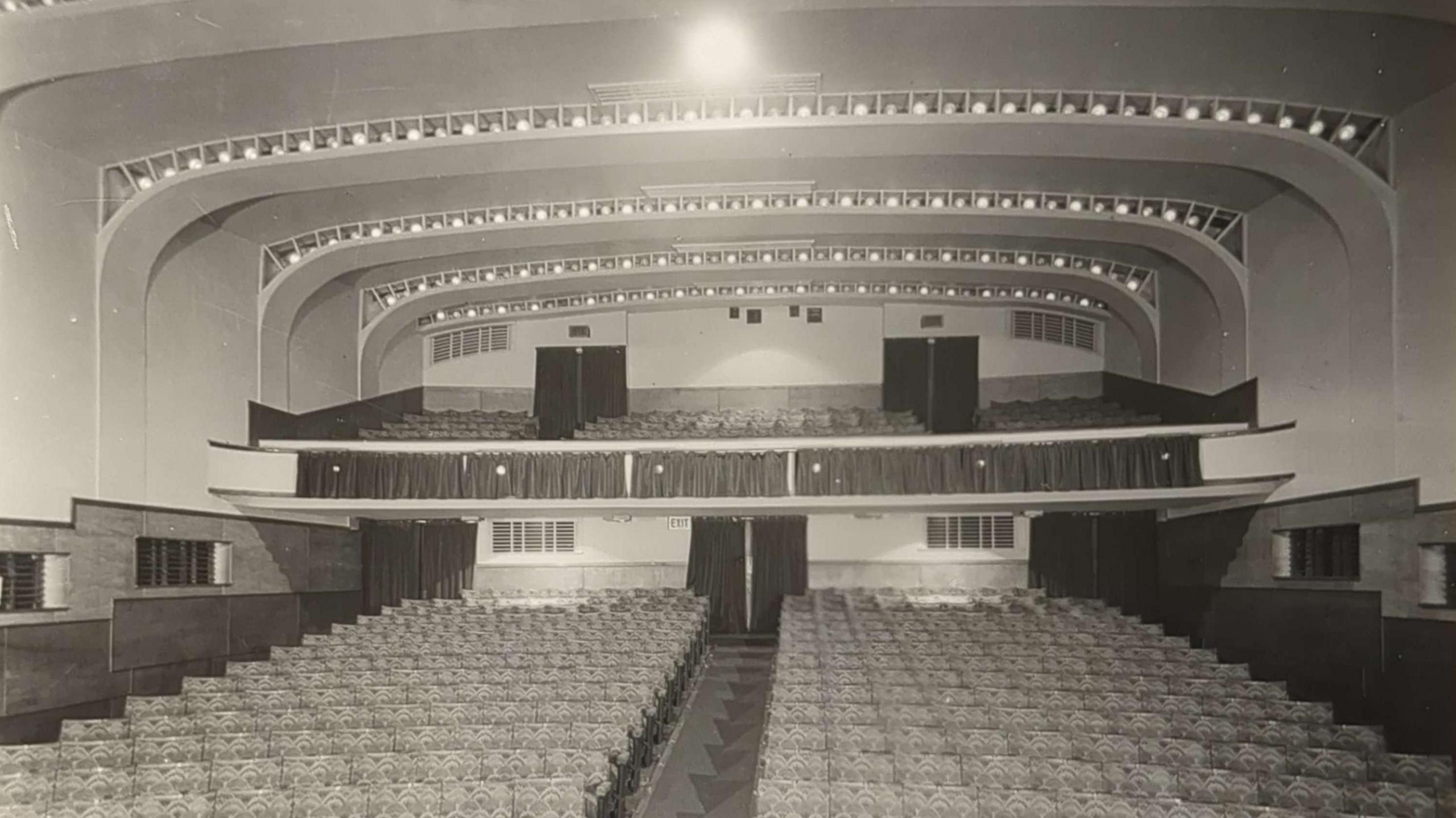 A black and white image of a theatre auditorium in the 1930s