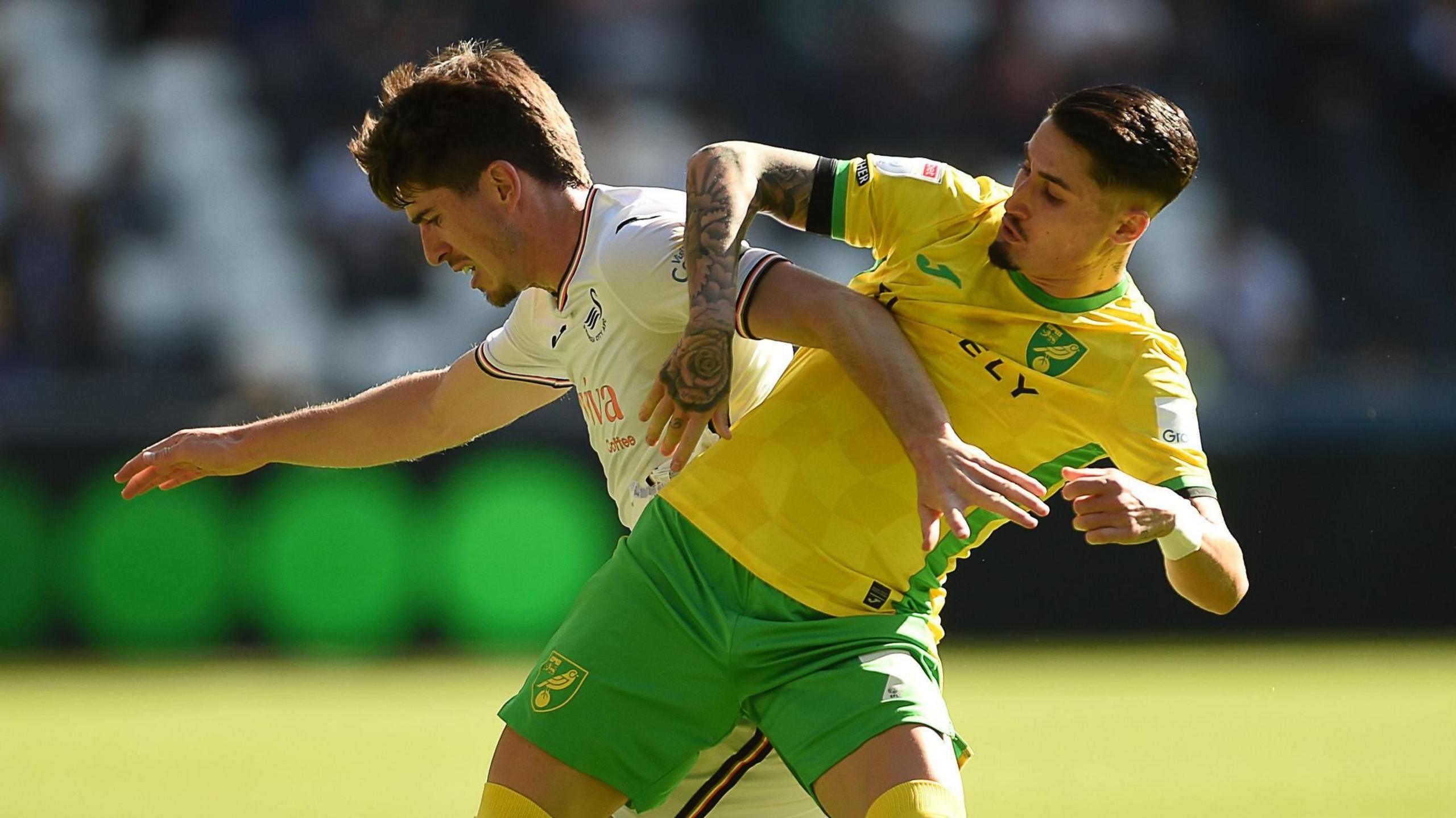 Swansea's Josh Key tangles with Norwich's Borja Sainz 