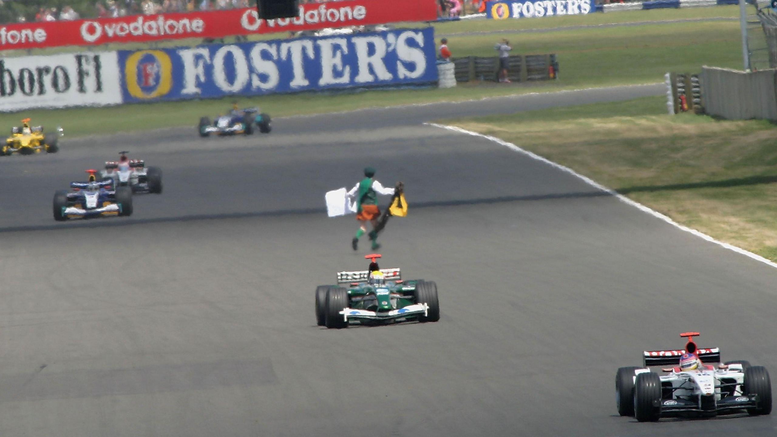 Religious activist and former priest Neil Horan runs onto the track during the 2003 grand prix. The safety car was deployed and Horan was imprisoned for aggravated trespass