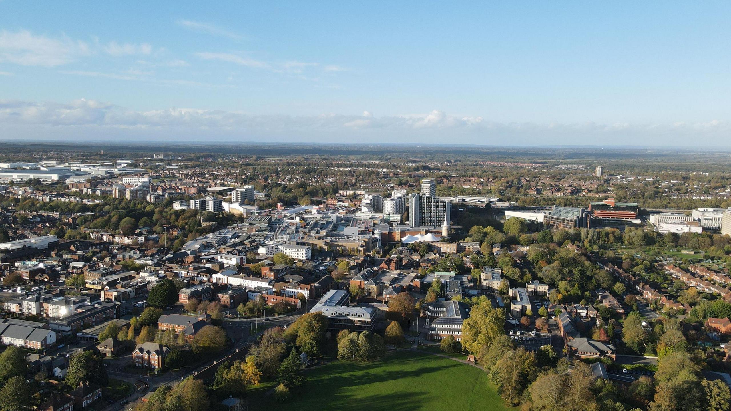 A bird's eye view of the town of Basingstoke on a clear day.
