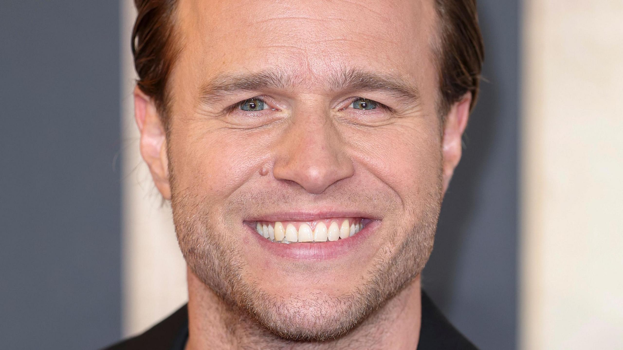 Close-up of singer Olly Murs smiling