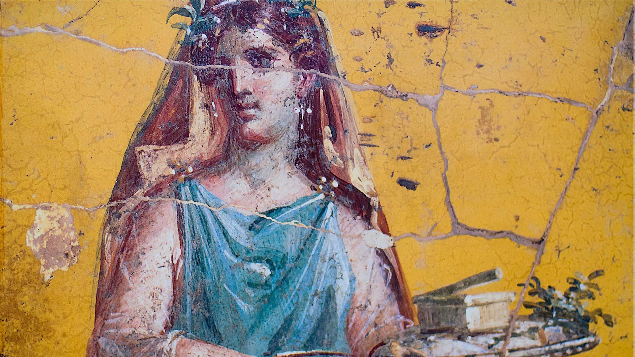 detail of the fresco in Pompeii with winged griffin on a red background Pompeian