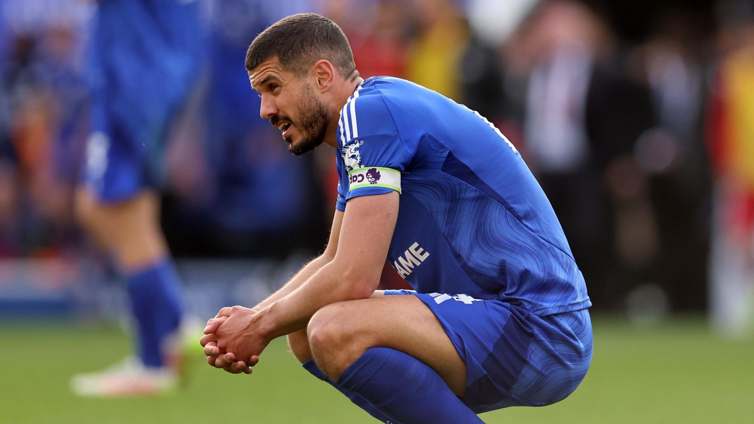 Conor Coady on his haunches as Leicester are relegated