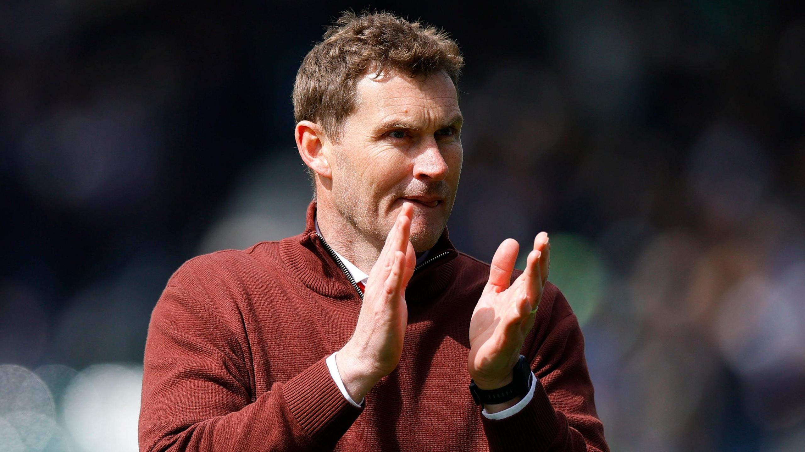 Exeter City interim boss Matt Taylor applauds