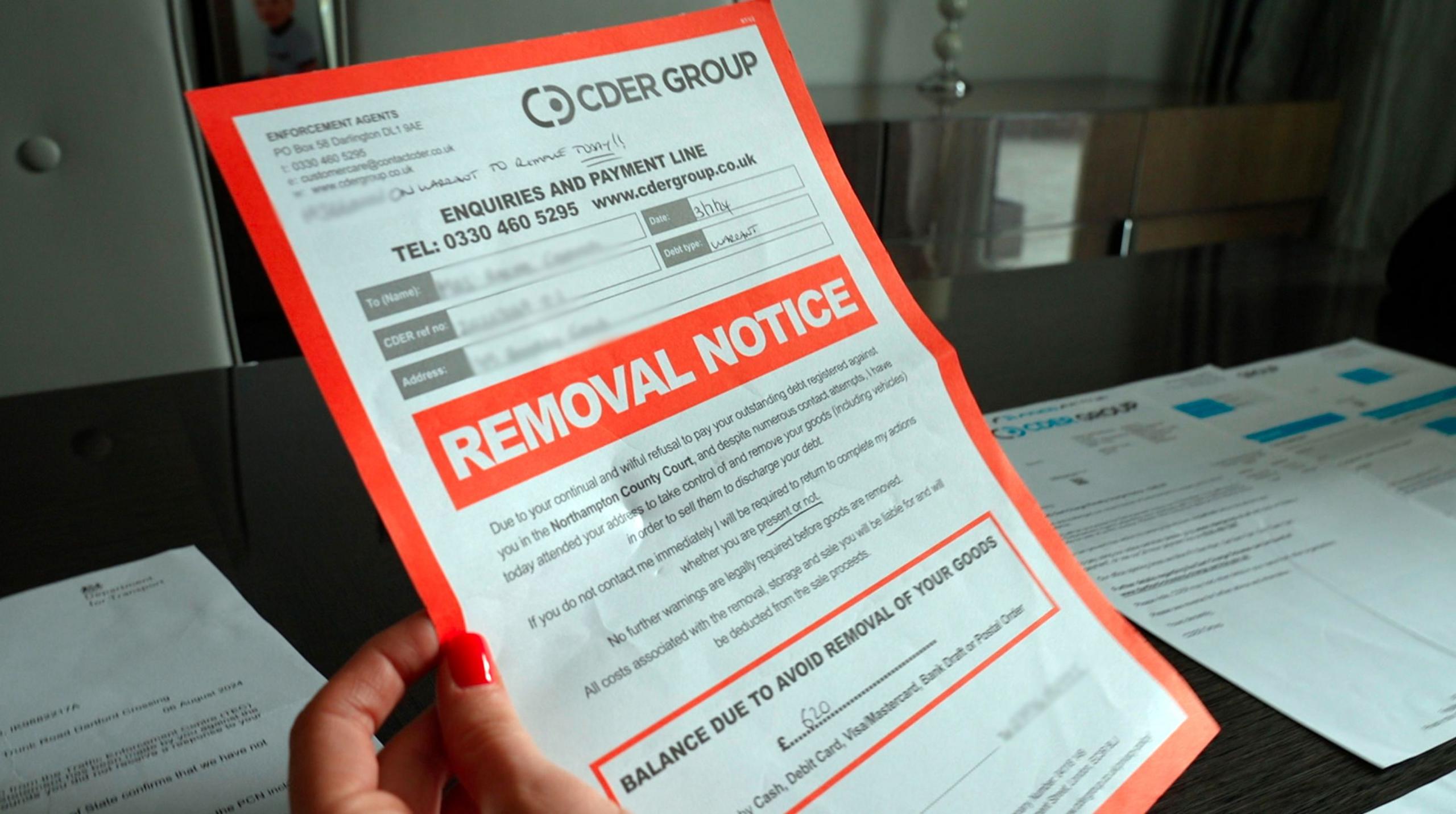 An A4 sheet with "Removal Notice" in large font in a red box and in the top right corner a logo of CDER Group.