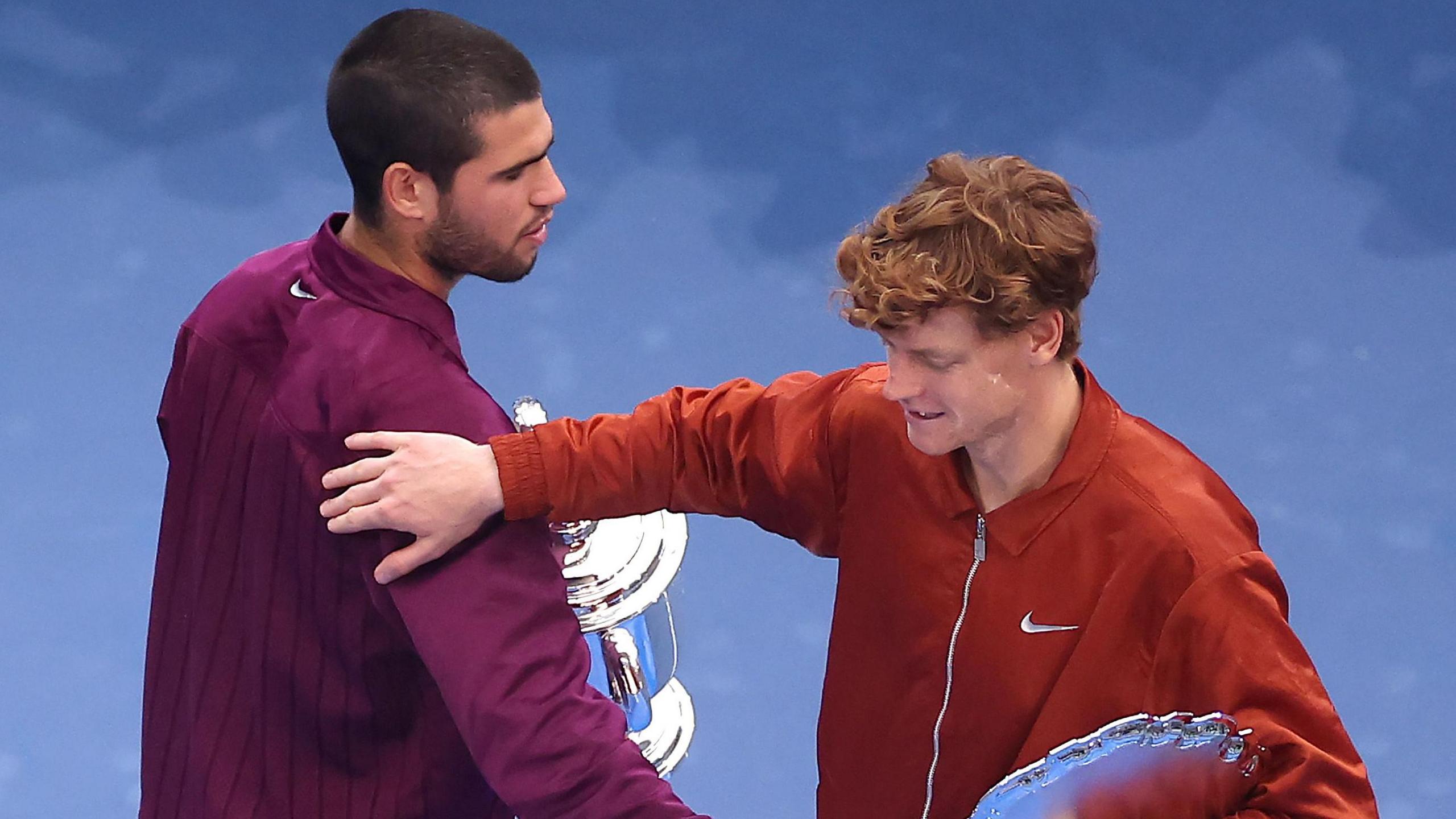 Carlos Alcaraz and Jannik Sinner embrace after their 2025 US Open title