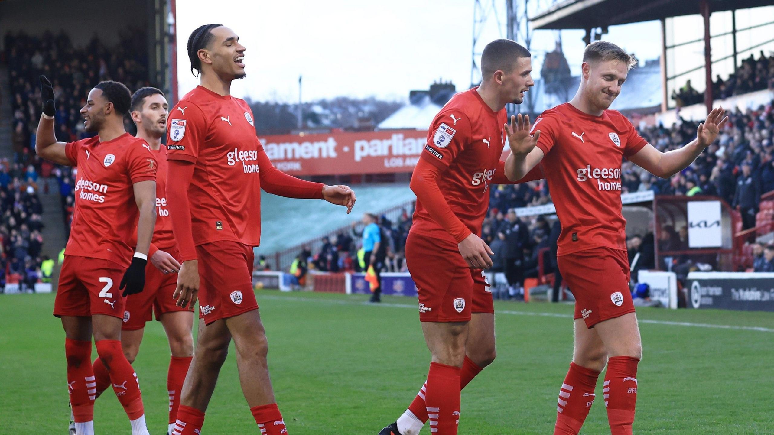 Barnsley players celebrates Davis Keillor-Dunn's (R) goal