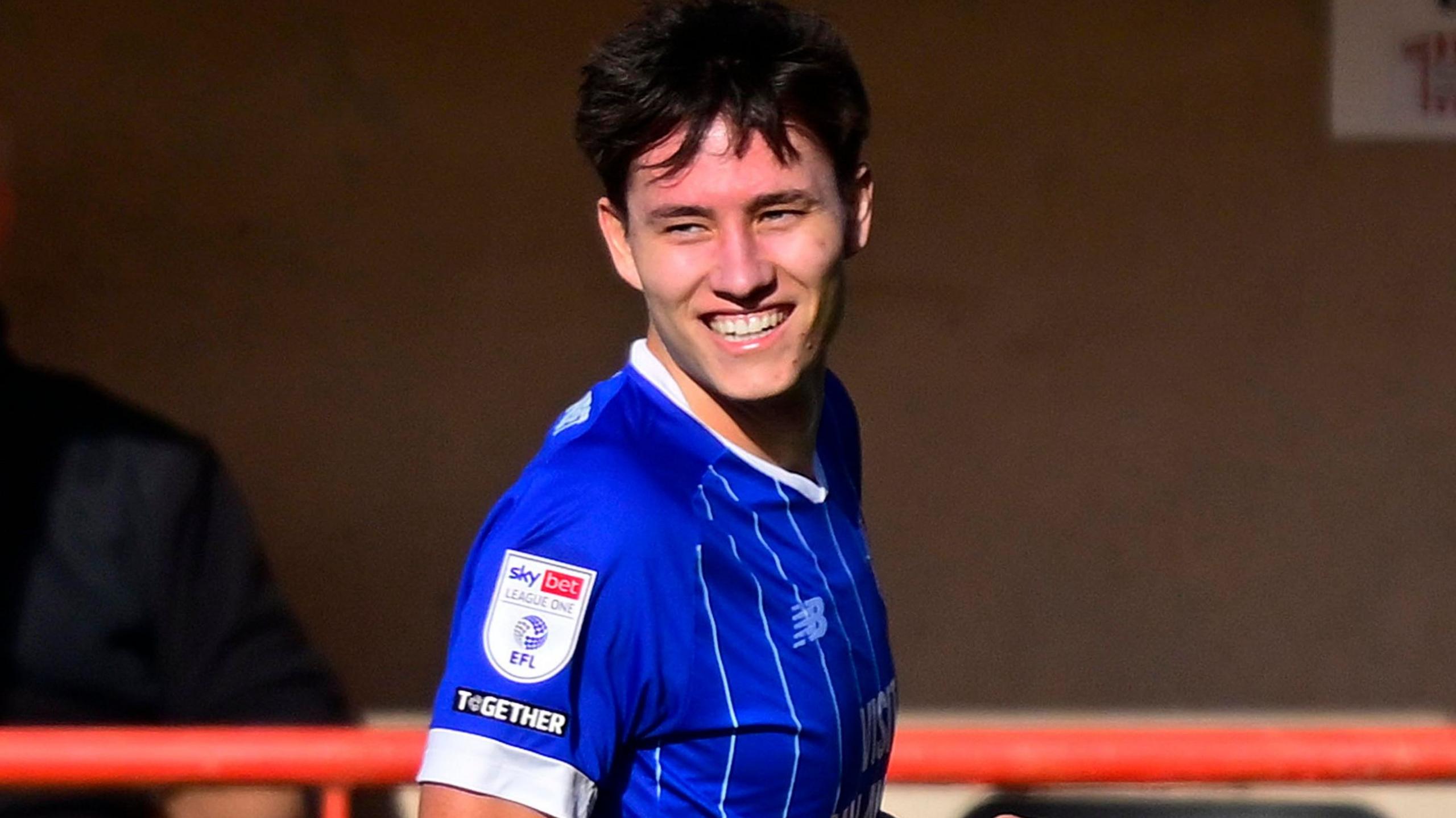 Rubin Colwill smiles after scoring at Exeter