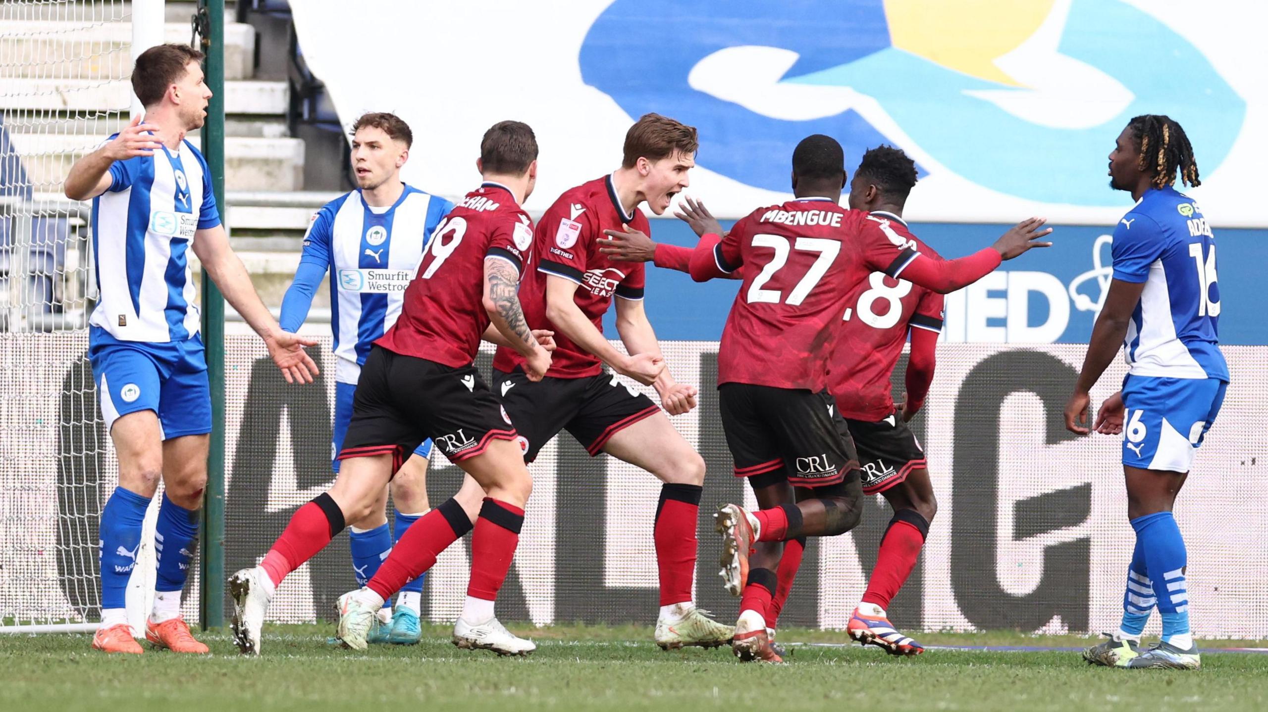 Reading celebrate their winning goal against Wigan at Brick Community Stadium