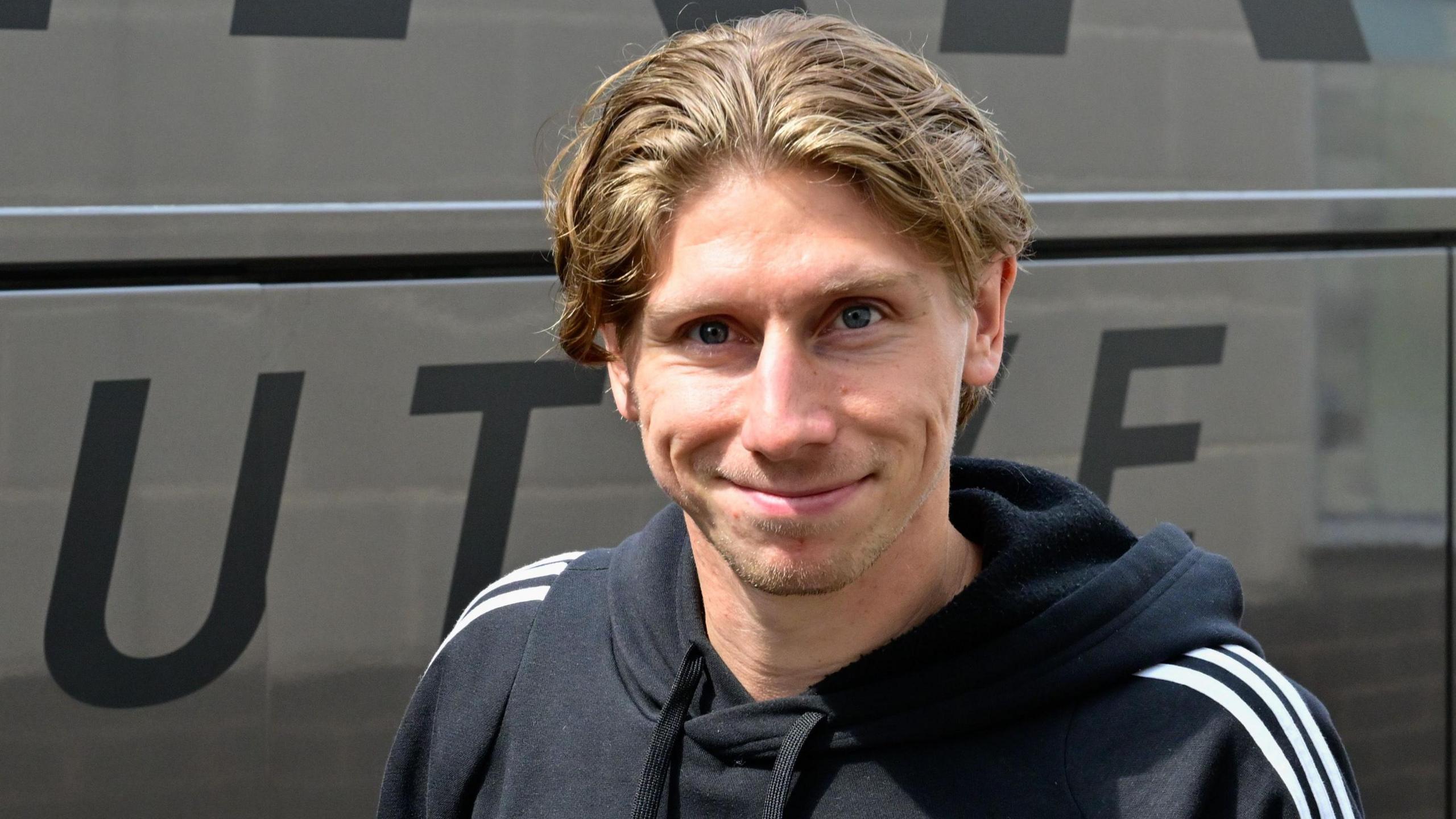 Alex Hartridge gets off the team coach during last season's loan spell at Exeter City