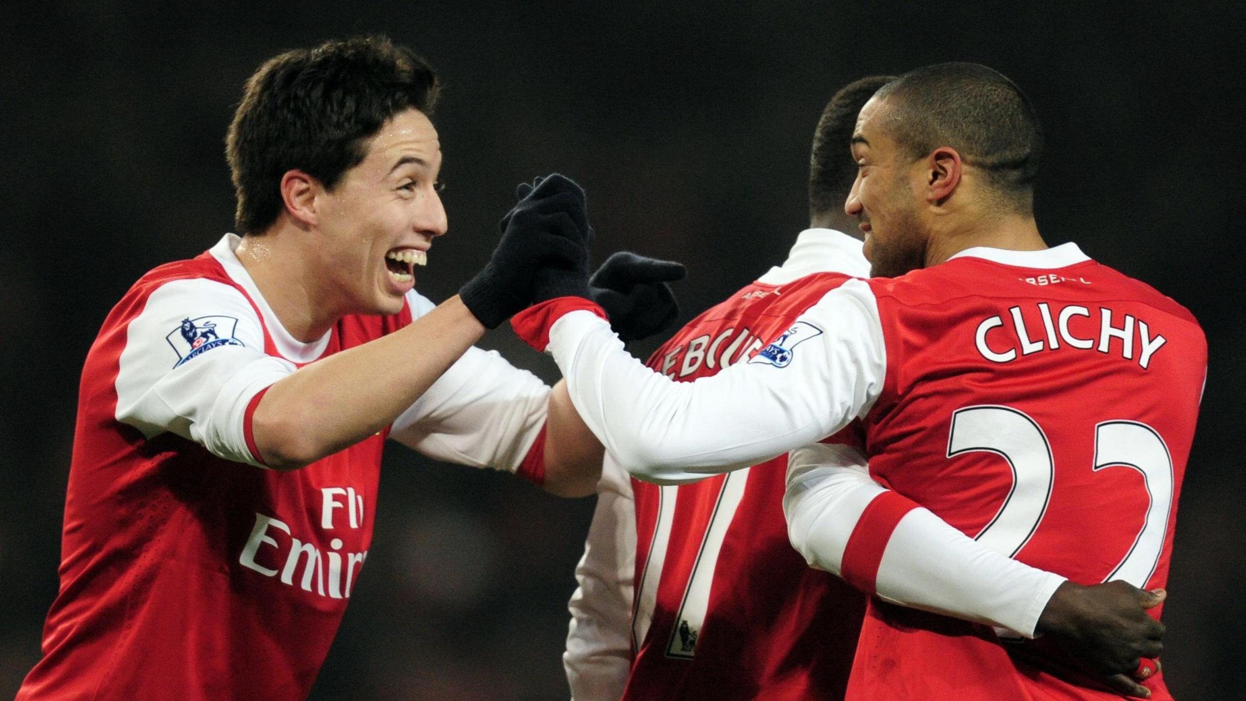 Gael Clichy celebrates with team-mate Samir Nasri after scoring for Arsenal