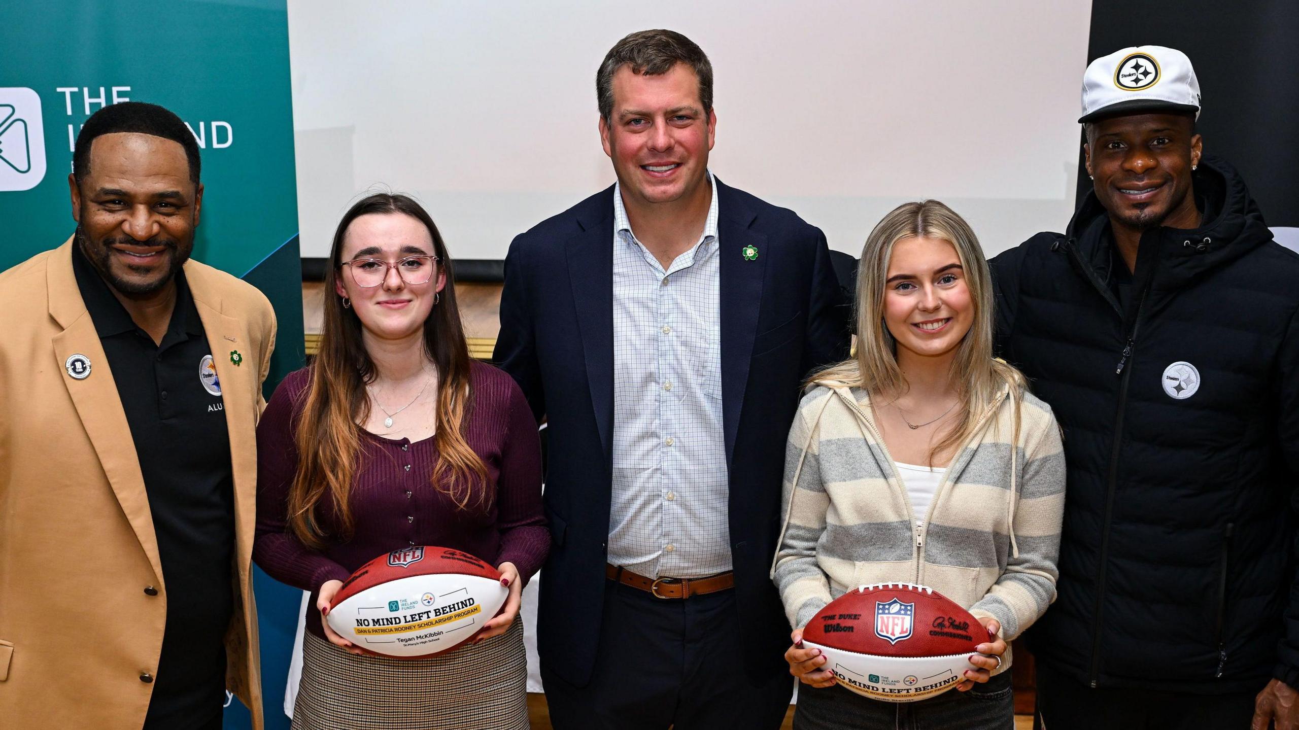 Steelers executive Dan Rooney and former players Jerome Bettis and Ike Taylor with pupils at St Mary’s High School in Newry