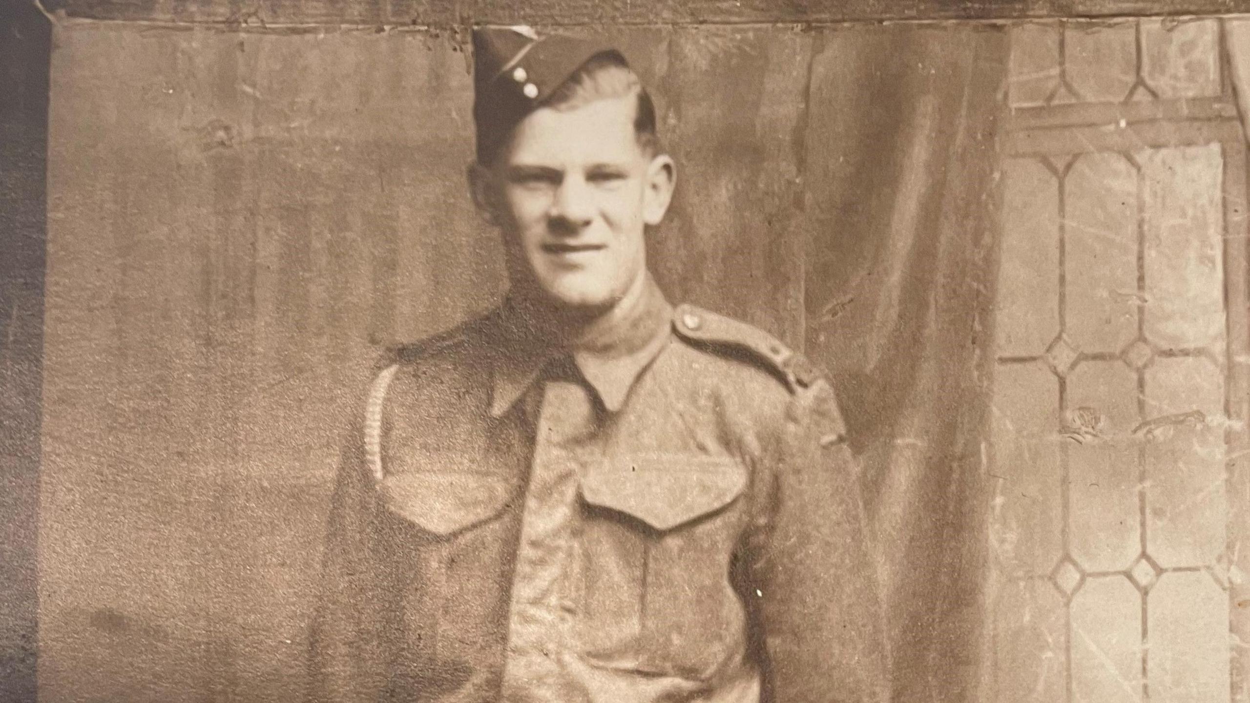 A black and white image of Jim Reynolds in military uniform.