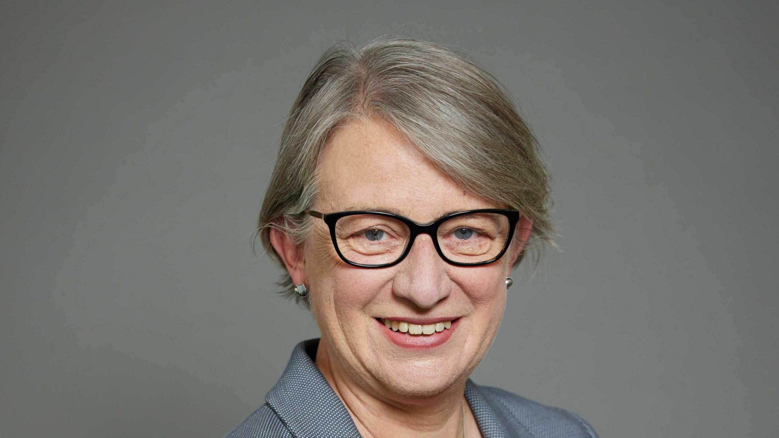 Natalie Bennett in her official House of Lords portrait wearing a grey suit jacket