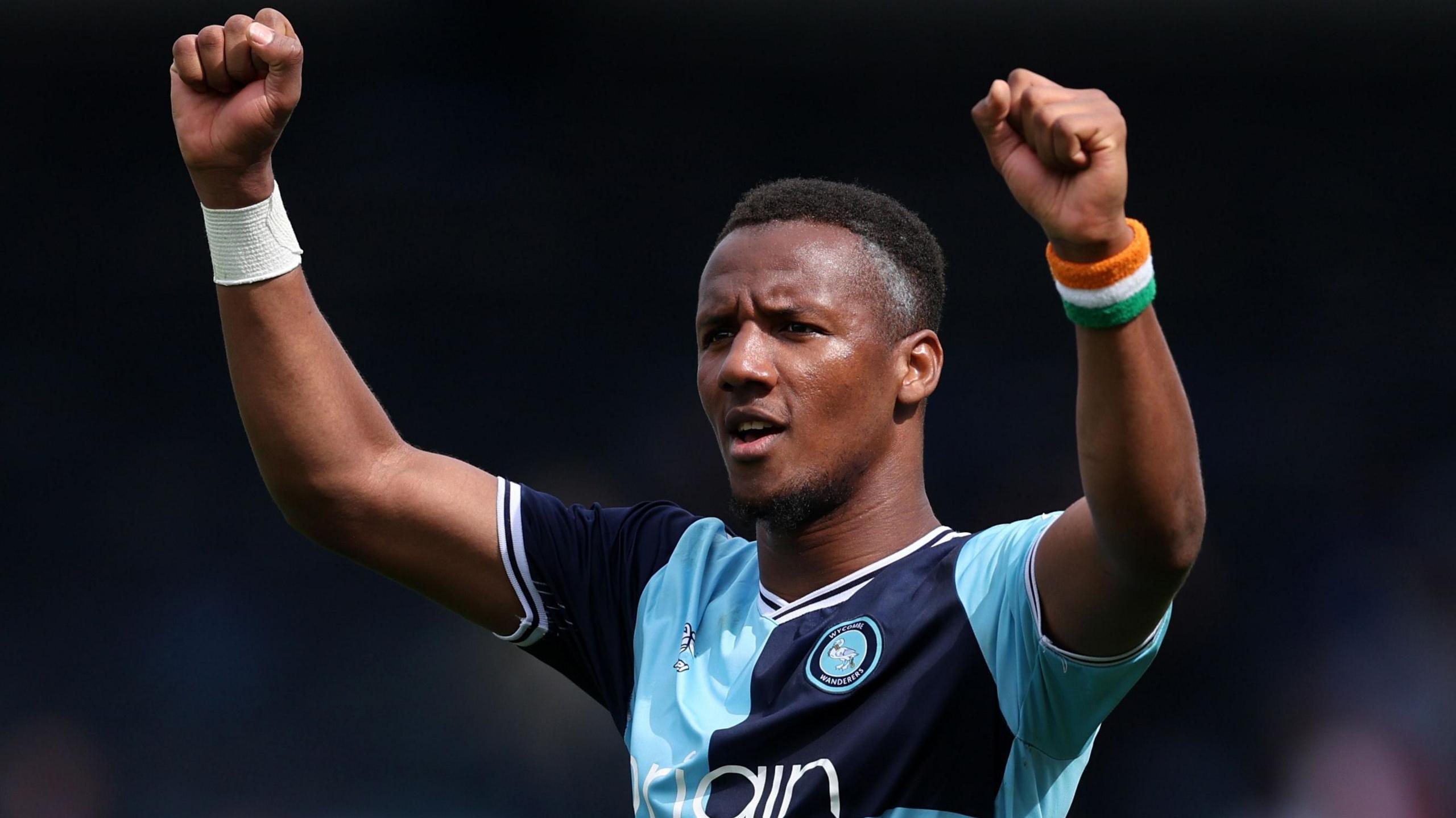 Richard Kone celebrates scoring a goal for Wycombe Wanderers