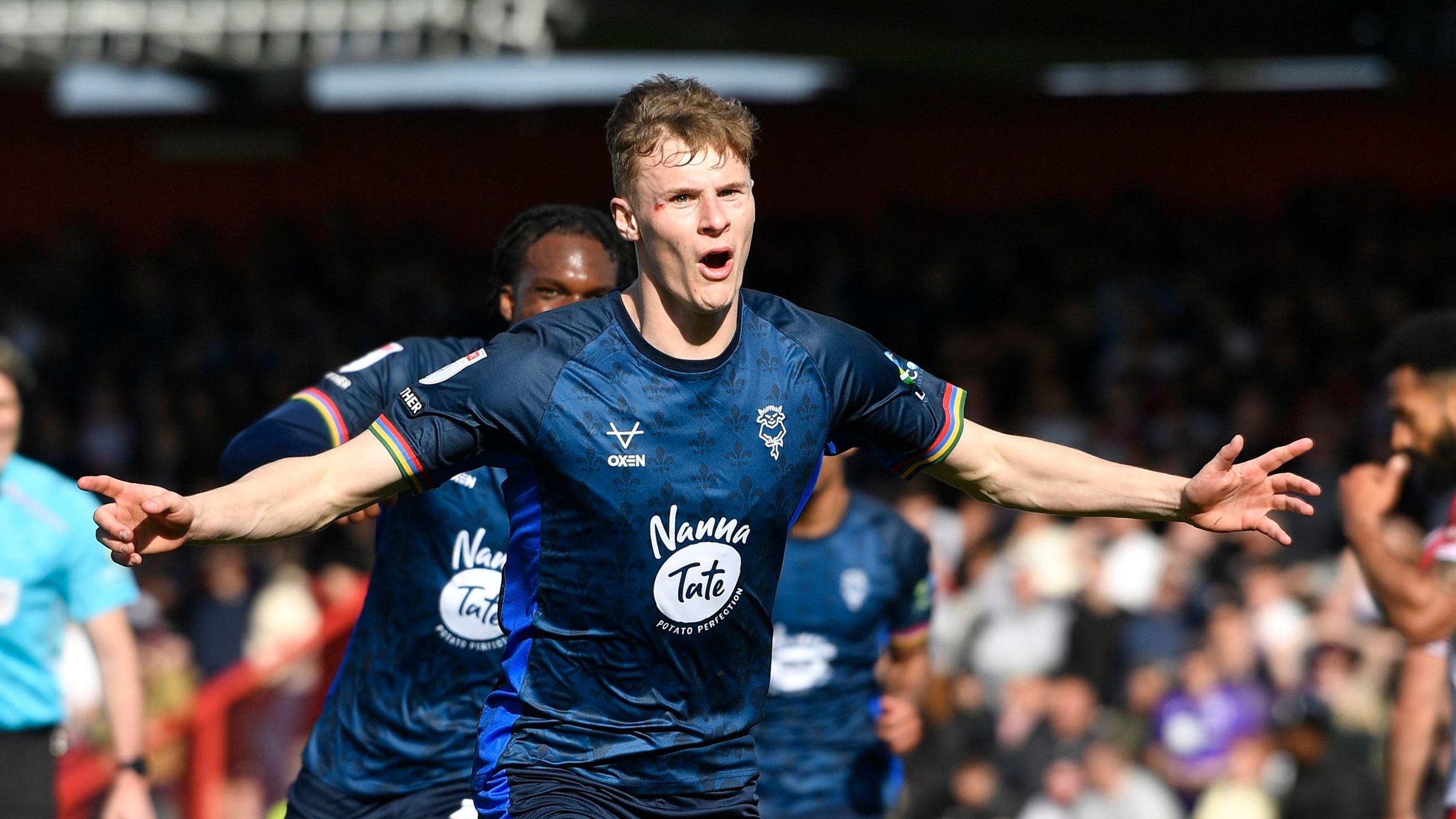 Rob Street celebrates scoring an equaliser for Lincoln City against Stevenage