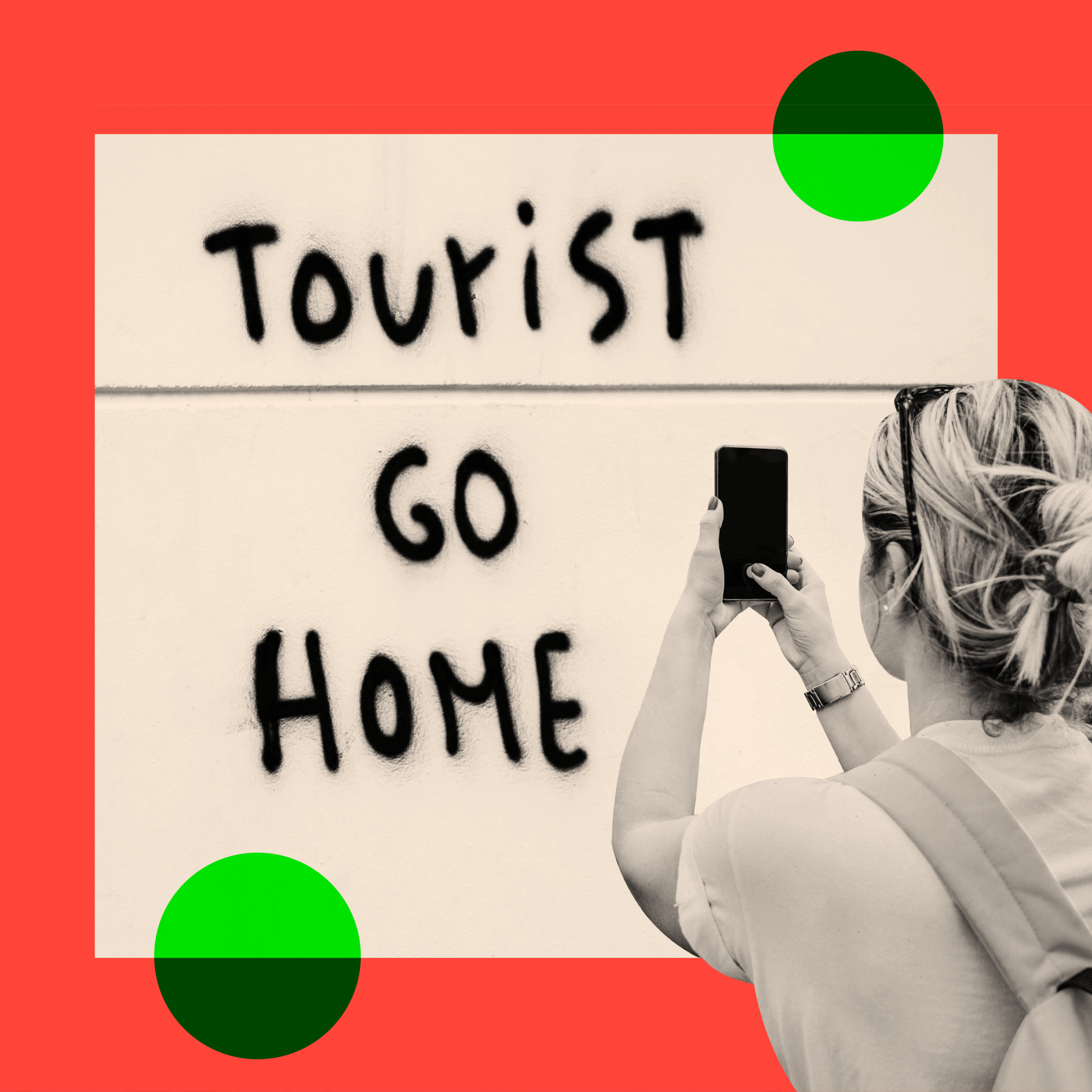 A sign that reads "tourist go home" and a woman photographing it