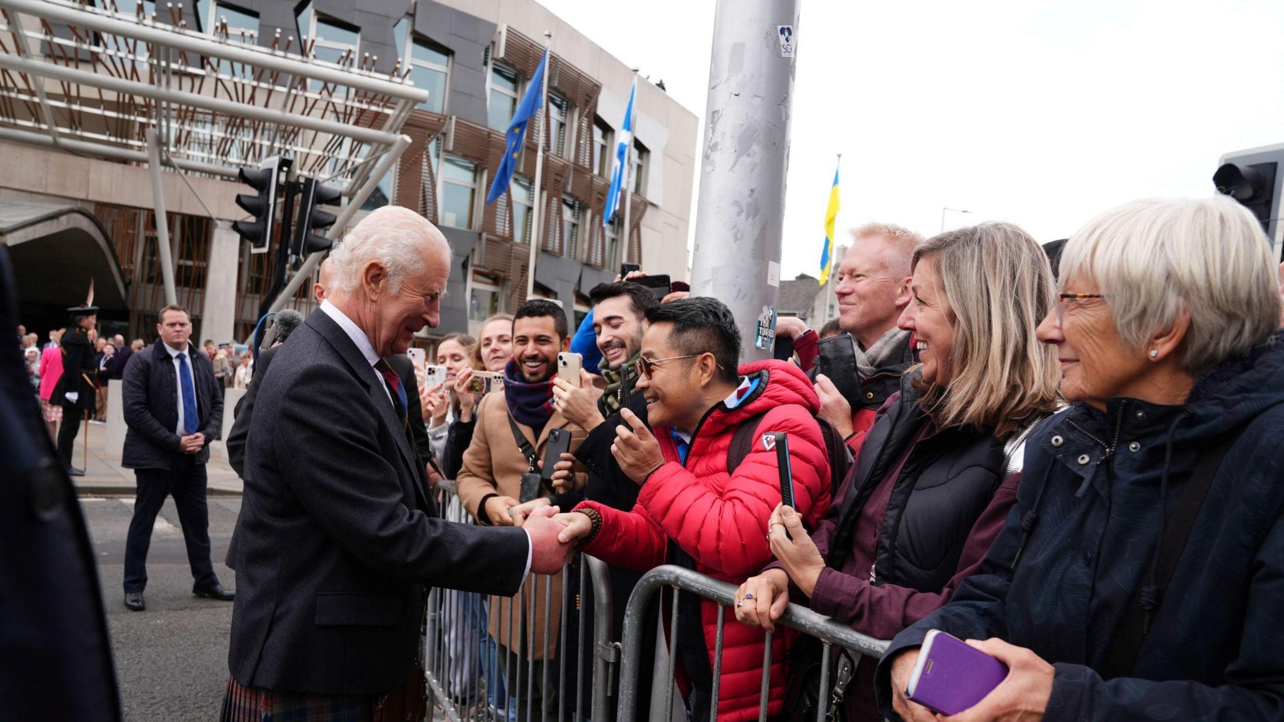 King Charles speaking to people Holyrood