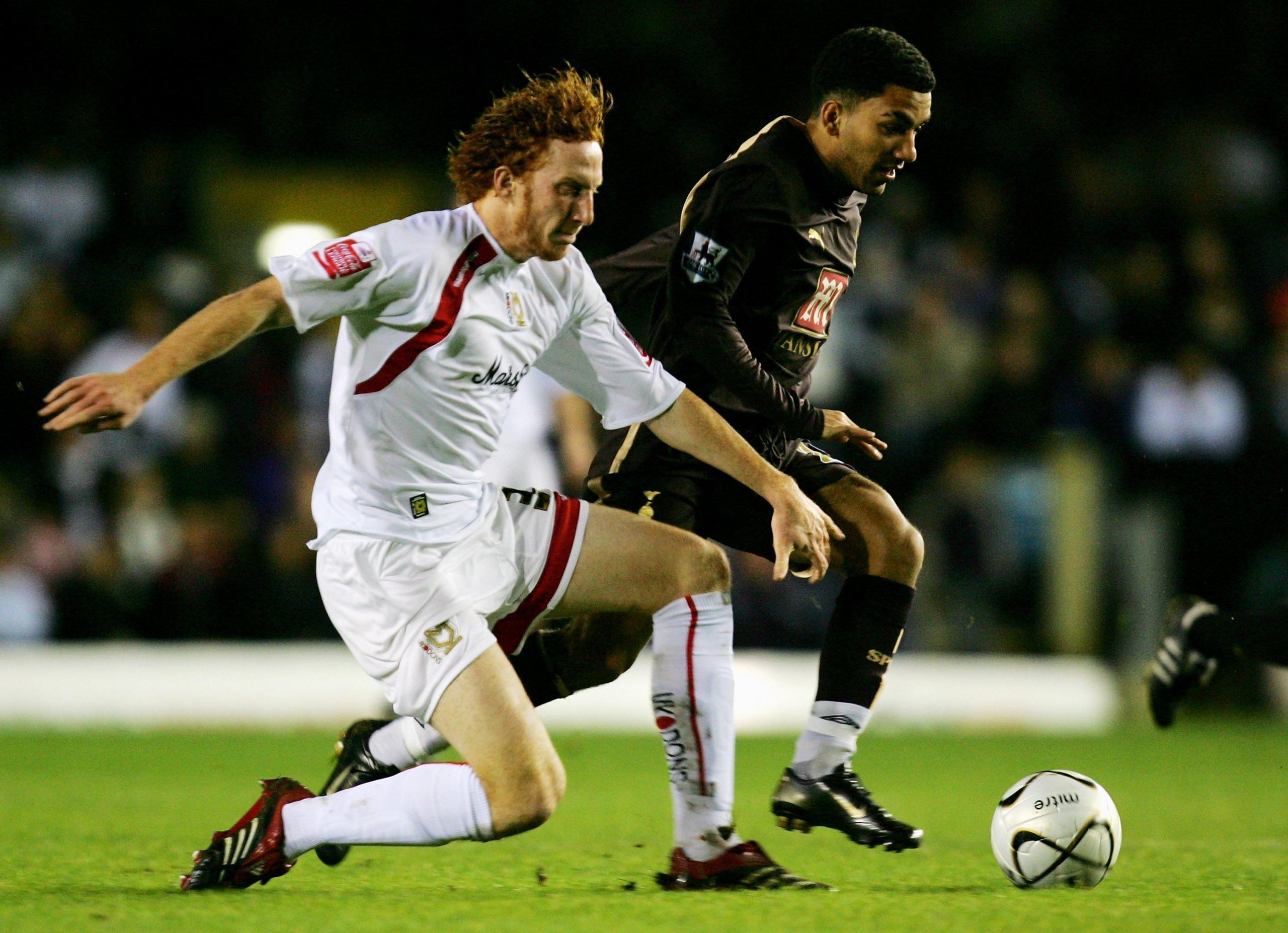 Dean Lewington playing for MK Dons against Tottenham