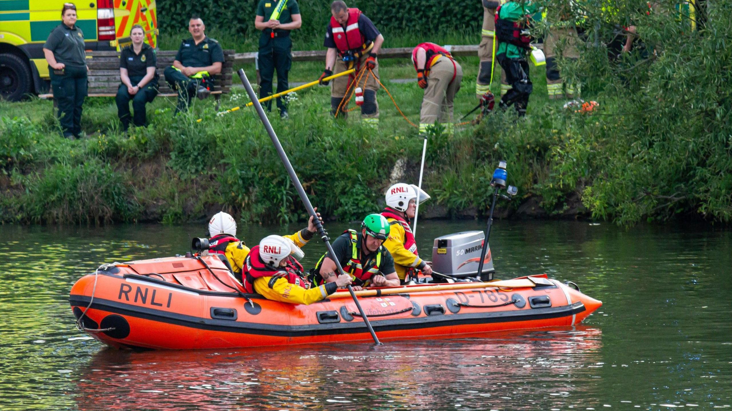 Search team looking in the river