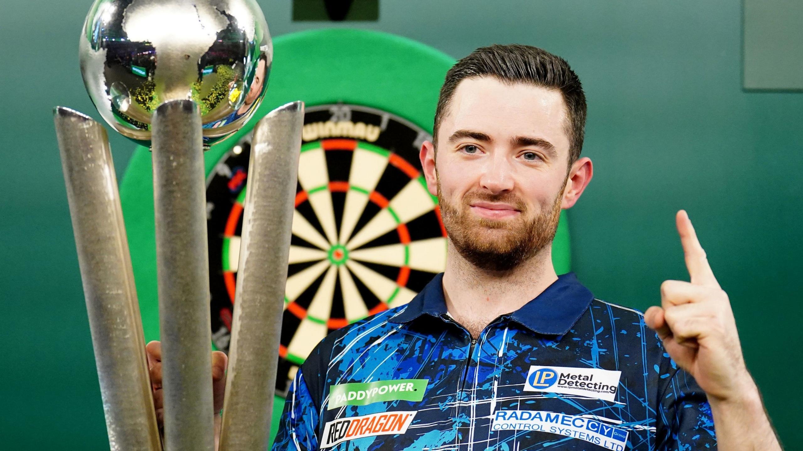 Luke Humphries with the World Championship trophy